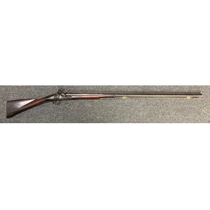Flintlock musket by "W Staples". 985mm long barrel. Bore approx. 17mm. Working action which holds both full and half cock. Complete with ramrod. Overall length 139cm. Note: Section 58 (2) No licence required in the UK.