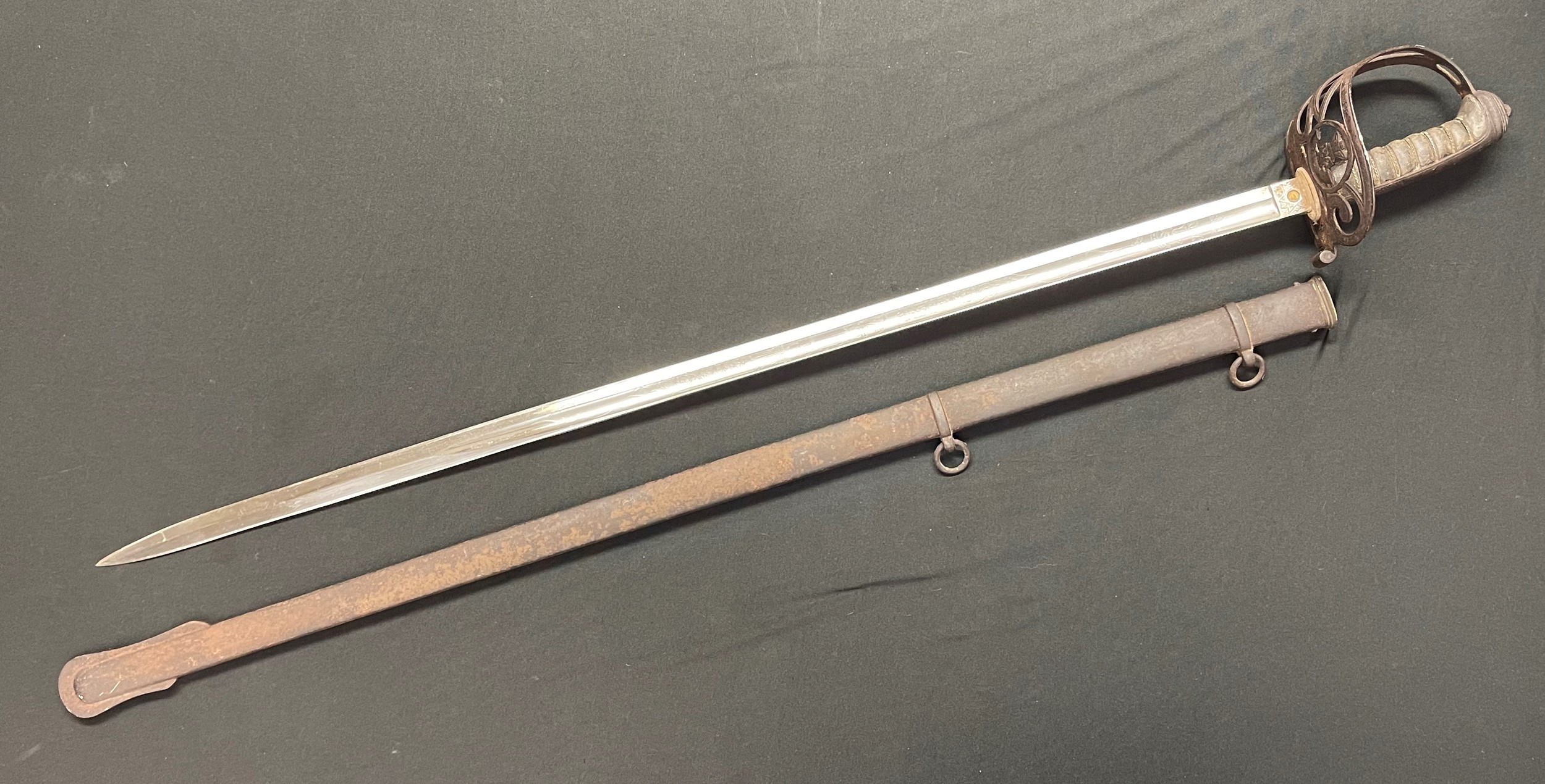 Victorian Light Infantry Officers Sword with single edged fullered etched proof blade maker marked "Henry Wilkinson, Pall Mall, London" numbered to spine of blade "15644", VR and Light Infantry badge, 825mm in length. Felt washer in place. Guard with Light Infantry badge, wire bound Shagreen grip. Overall length 980mm. Complete with scabbard with twin suspension rings. New to the market.