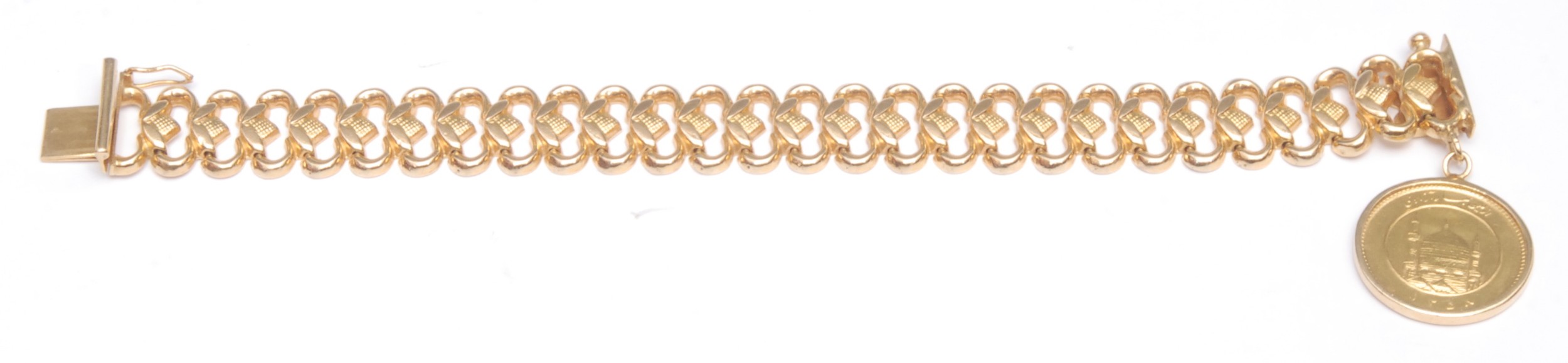 An Iranian 22ct gold bracelet, suspended with a 22ct gold coin, The Freedom Coin, equivalent to 1 Pahlavi, Iranian date 1358, 34.37g gross
