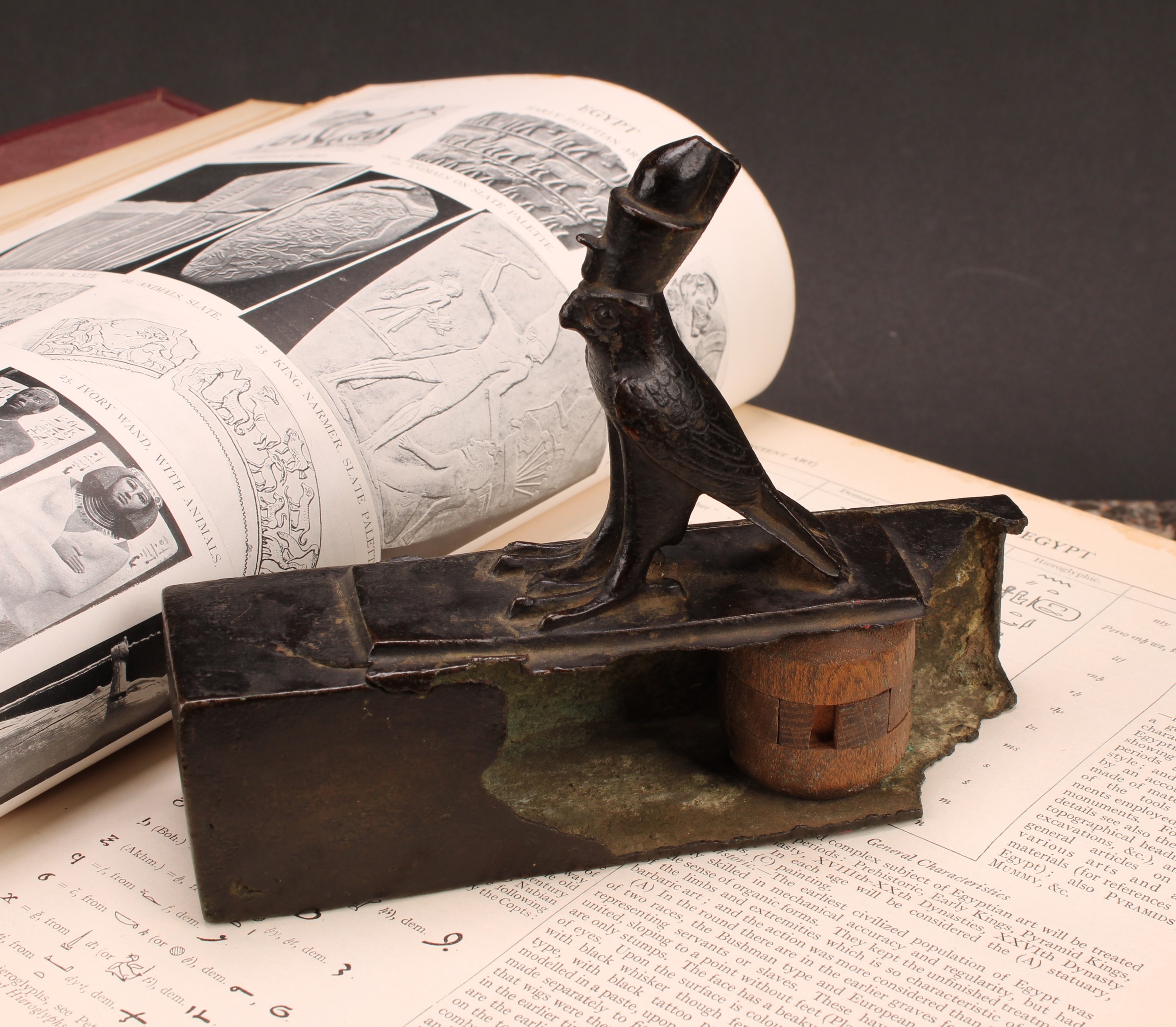 Antiquities - an Ancient Egyptian bronze falcon sarcophagus, crested by the figure of Horus, 17cm long, Late Period to Ptolomaic Period, c.664 - 30 BC