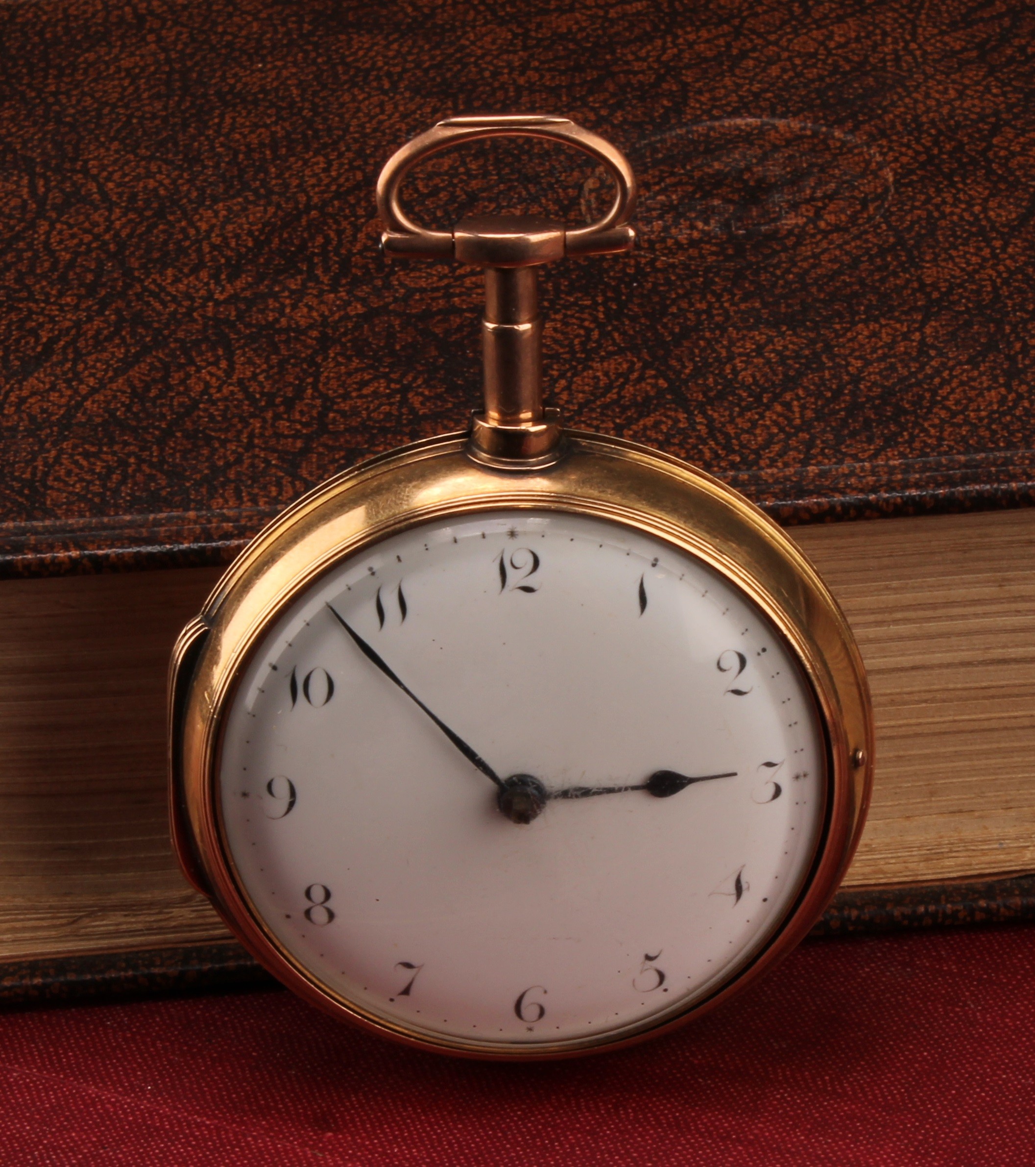 A George III 18ct gold pair cased pocket watch, Stephen Reed, New York, white enamel dial, Arabic numerals, signed movement, numbers 145*, chain drive fusee movement, 54mm diameter 18ct gold case, John Nevill, London 1805, 130.6g gross