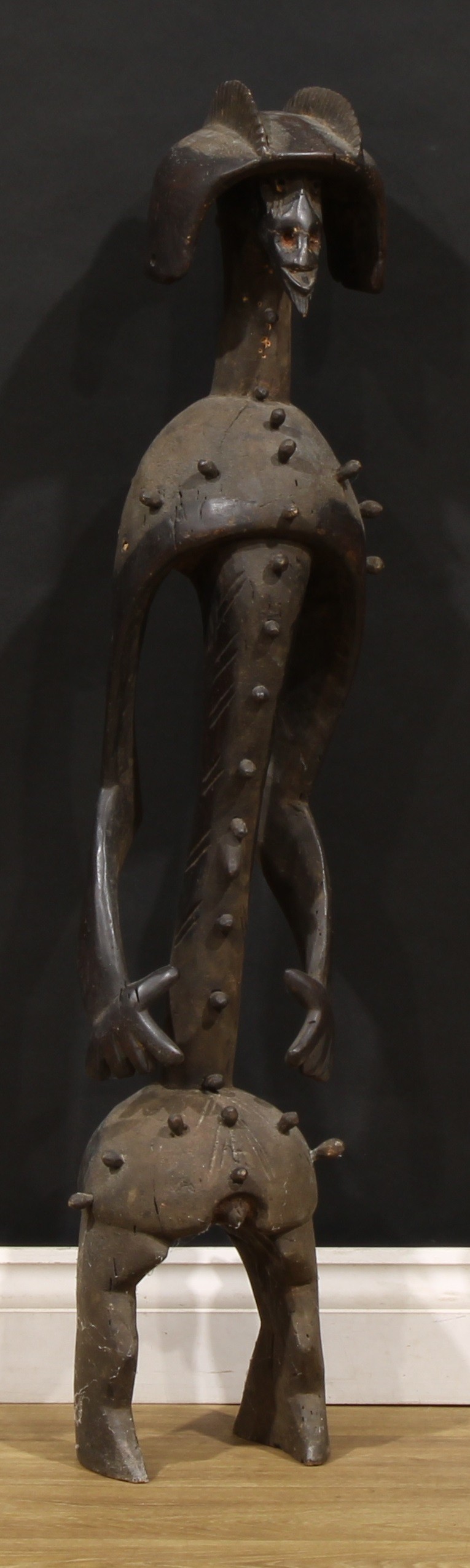 Tribal Art - a large Mumuye figure, of typical elongated form, highly stylised features and coiffure, applied overall with nodules, 104cm high, Nigeria/Cameroon