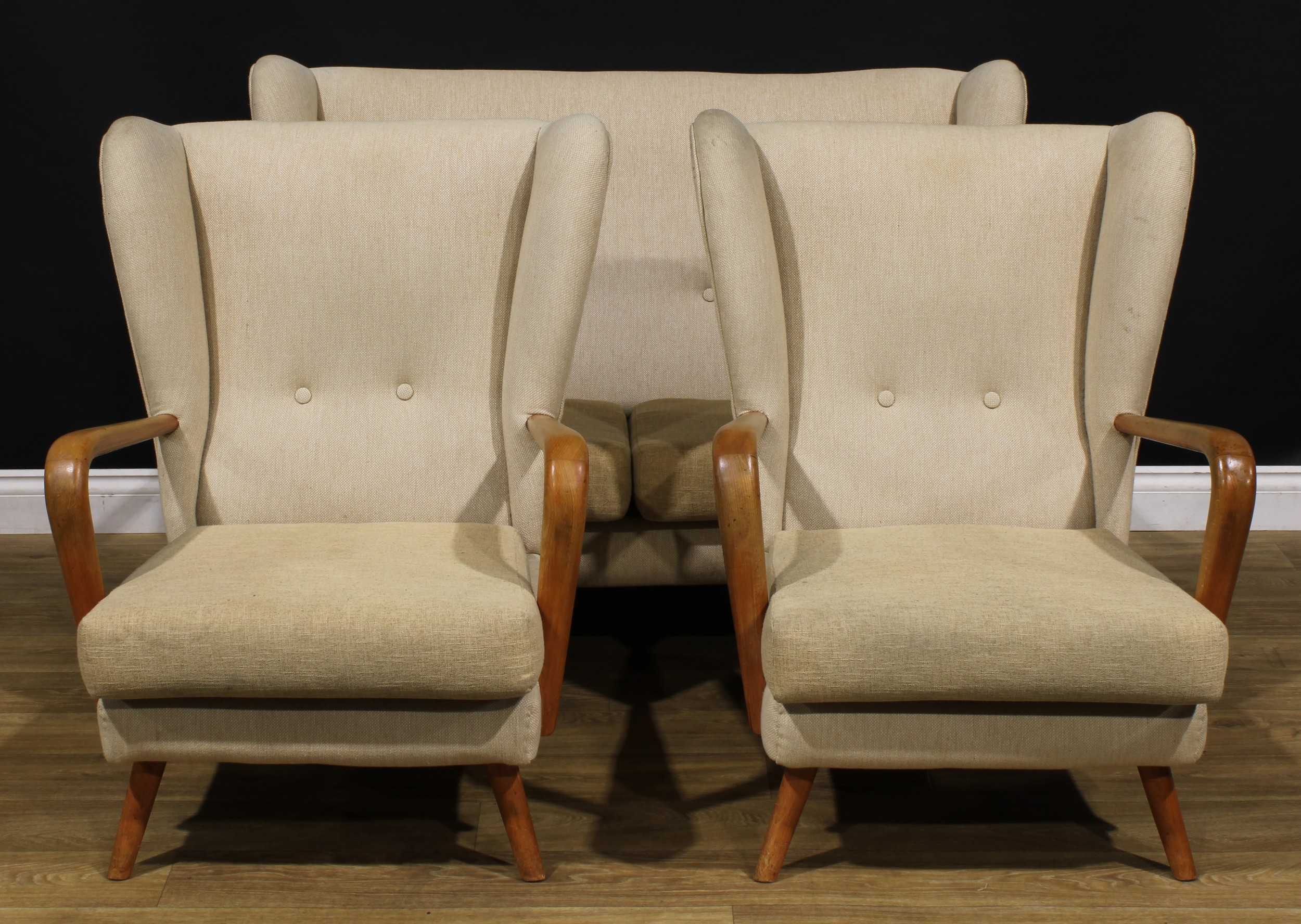 Mid-century Design - a three-piece lounge suite, Bambino, by Howard Keith for HK Furniture, comprising sofa and a pair of armchairs, the sofa 90cm high, 133cm wide, the seat 112cm wide and 52cm deep, the chair 90cm high, 72cm wide, the seat 54cm wide and 51cm deep, c.1955  NB - This lot is offered for sale as a work of art, the cushions may not comply with the Furniture and Furnishings (Fire) Safety Regulations 1988 and for this reason should not be used in a private dwelling.