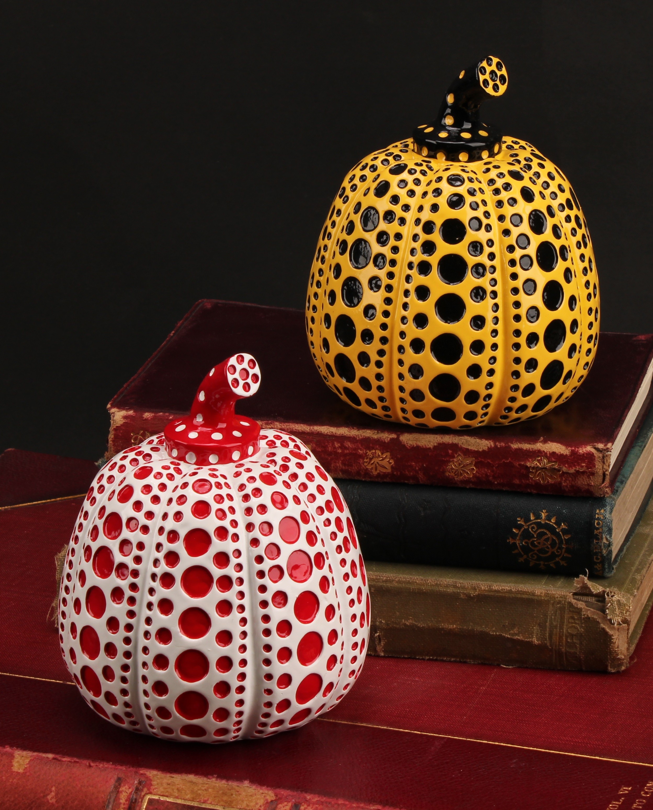Yayoi Kusama (b.1929), a pair of painted cast resin multiples, Red & White Pumpkin and Yellow Pumpkin, 2016, each stamped with the artist's name on the base, 11cm high