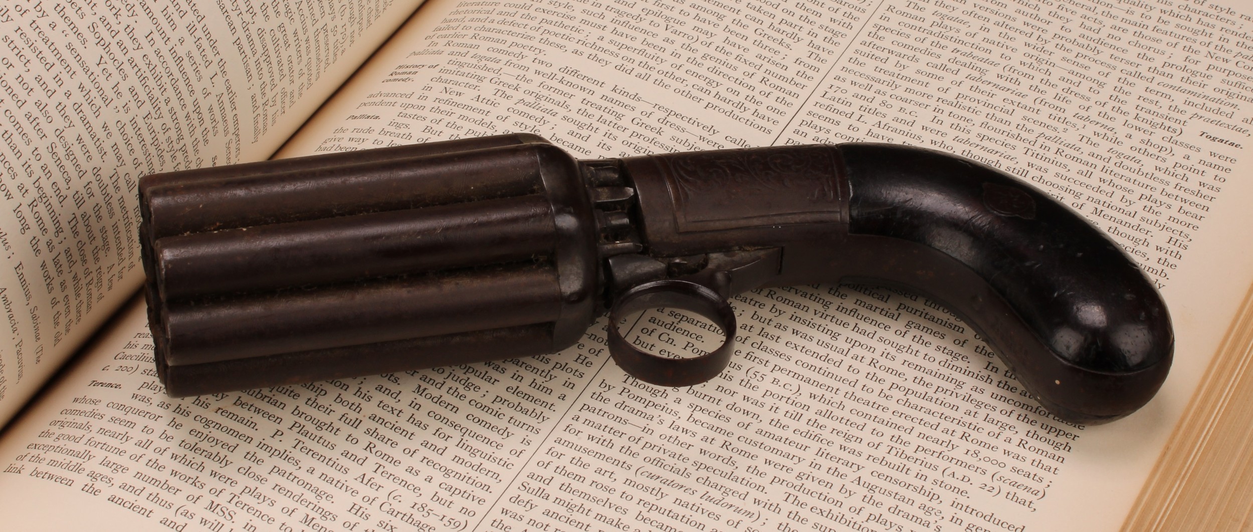 A 19th century eight-shot pepper-box revolver, 7.5cm barrel, engraved lock plate, two-piece grip, 19cm long, c.1860. NOTE: Section 58 (2) No Licence required in the UK.
