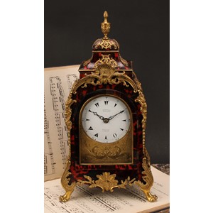 A George III gilt metal mounted tortoiseshell musical table clock, for the Turkish market, 10cm enamel dial inscribed MARKWICK MARKHAM PERIGAL LONDON, Turkish numerals, eight day movement striking on a nest of eight bells with sixteen hammers, ninth hour-strike bell, engraved backplate inscribed John Barbot London, 39cm high, 20.5cm wide, 14cm deep