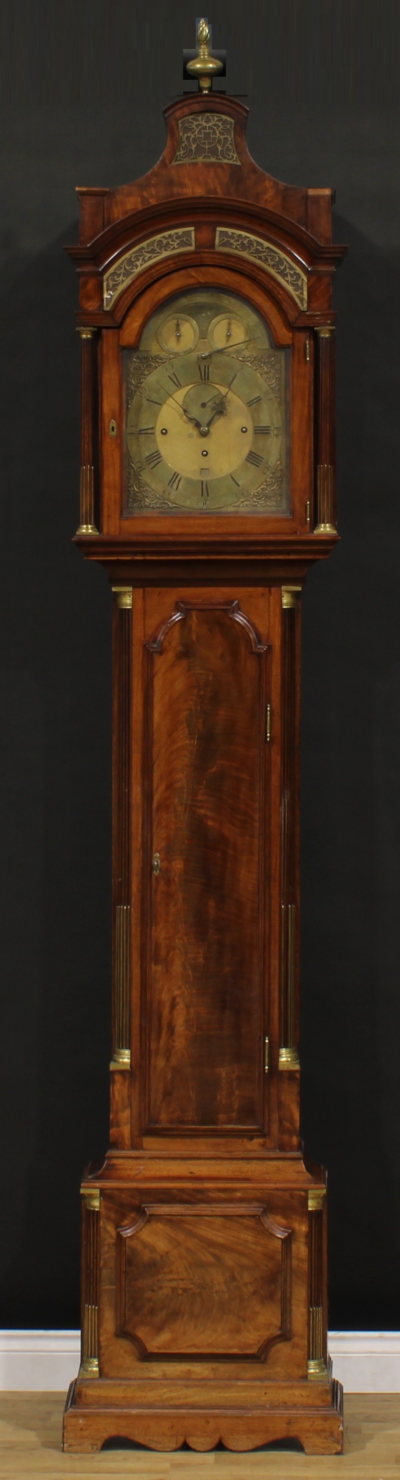 A George III mahogany musical longcase clock, 30.5cm arched brass dial inscribed Peter Paulsen, Zeist, Roman and subsidiary Arabic numerals, subsidiary seconds dial, date aperture, triple winding holes, eight day movement striking on a nest of eighteen and one single bell, air, strike/silent and play/not play selectors to arch, one additional cylinder, the case with pagoda top set with blind fretwork panels, shaped rectangular door flanked by stop-fluted quarter-columns, 265cm high, 53cm wide, 26cm deep