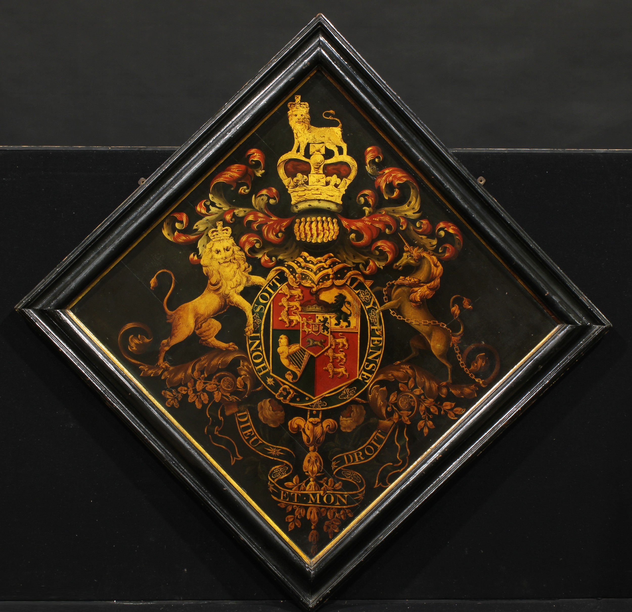 Heraldry - a panel of Royal Arms, probably for display in an Anglican church, gilt and polychrome painted with the Coat of Arms of the United Kingdom centred by the Royal Arms of the Electorate of Hanover, ebonised frame, oil on panel, 151cm x 151cm