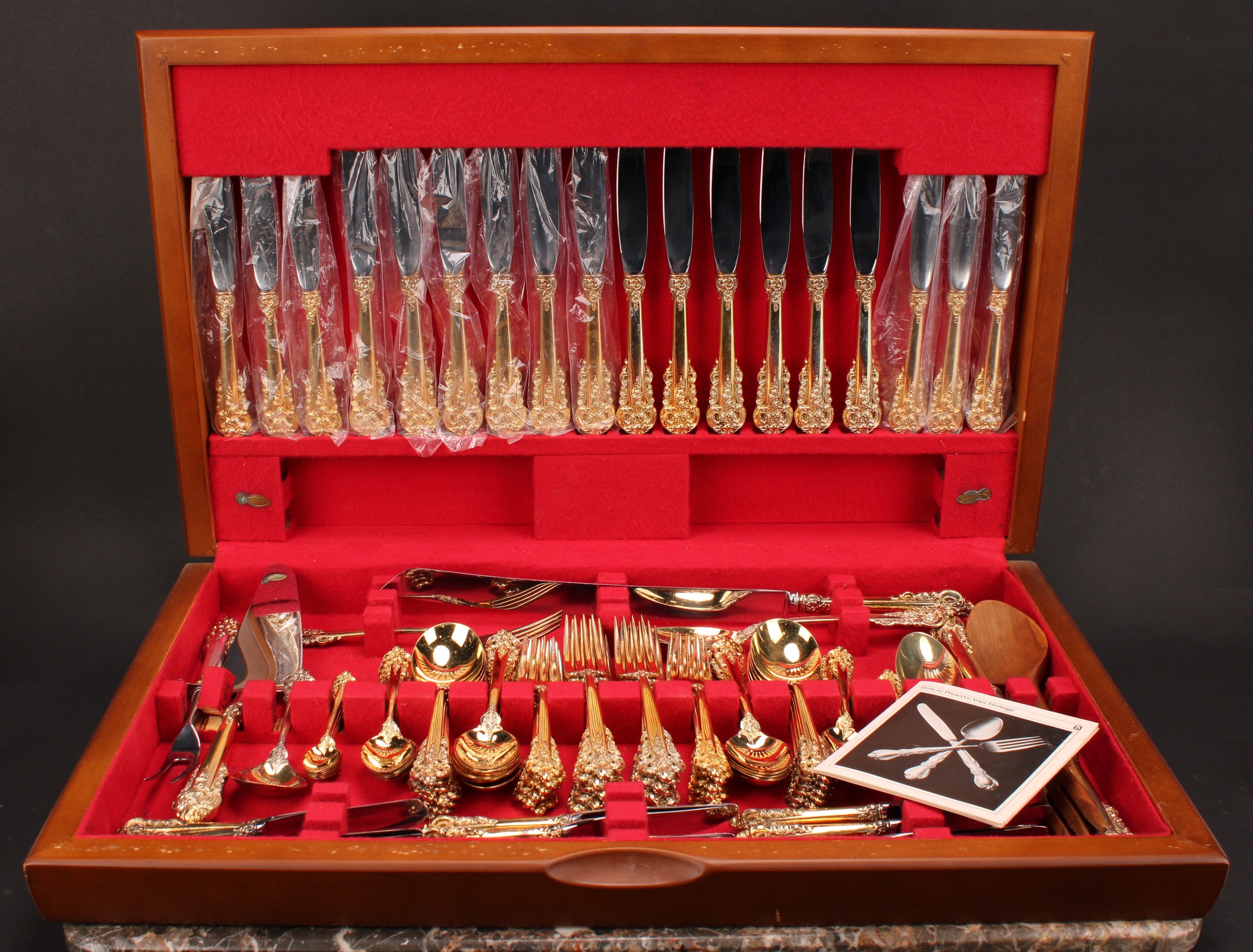 A silver gilt Wallace Grande Baroque pattern 111-piece canteen, marked sterling, 3,890g weighable, cased