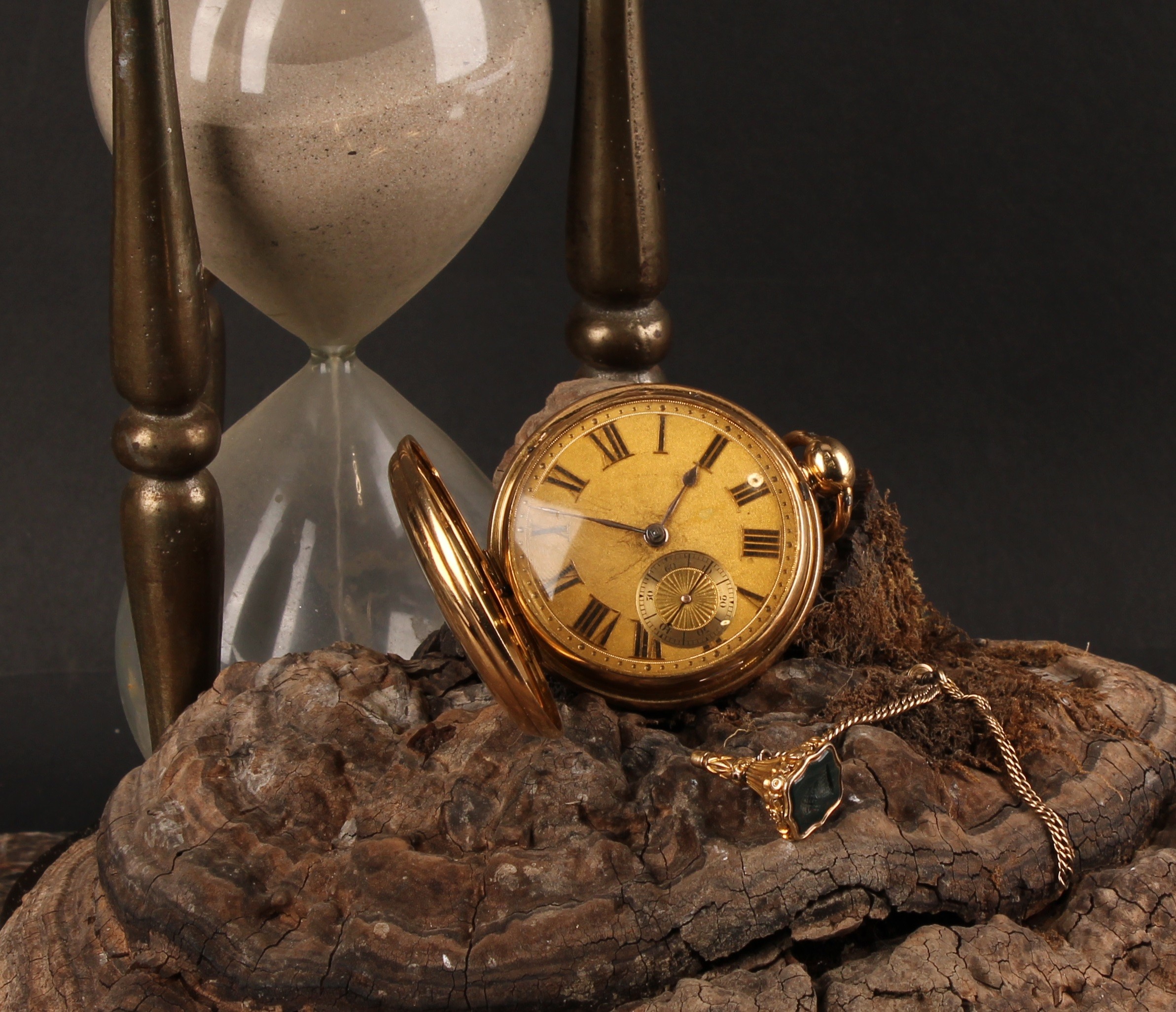 A George III 18ct gold Scottish hunter pocket watch, by Andrew Milroy, Edinburgh, 4.5cm textured dial applied with Roman numerals, subsidiary seconds dial, fusee movement no.1169 with diamond end-stone, the case with engraved with the arms and motto of Robertson, 7.5cm over loop, London 1820; gold coloured metal fob key ensuite, the blood agate seal matrix with armorial intaglio, associated Victorian rosewood case