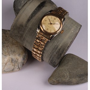 A gentleman's Rolex Oyster Perpetuel Chronometre, gold plated stainless steel, bubble back, Champagne dial baton indicators with Roman numerals to quarters, centre seconds hand, Rolex Oyster winder, integral expanding bracelet strap, with box