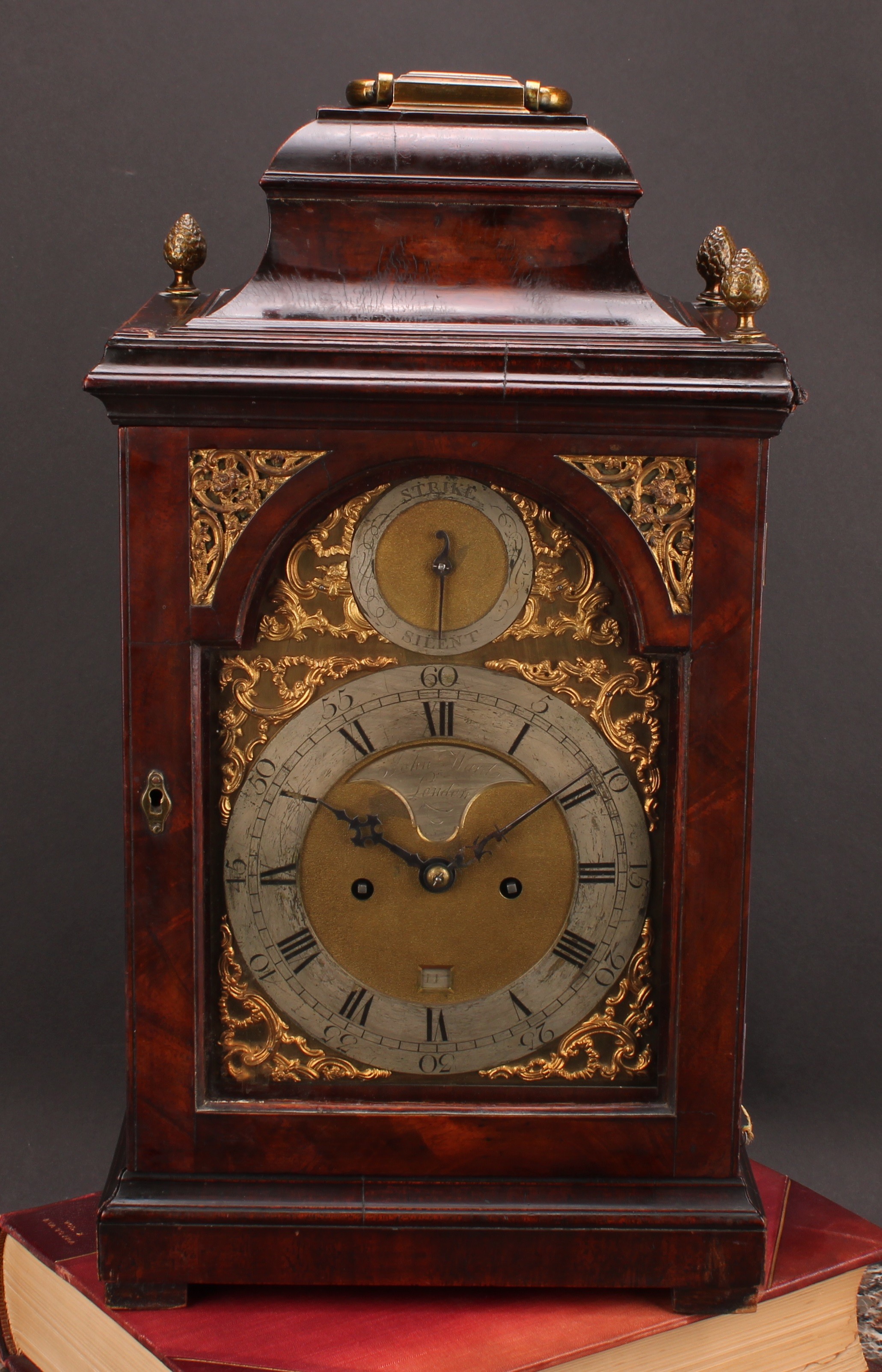 A George III mahogany repeating bracket clock, 17.5cm arched brass dial with silvered chapter ring and cartouche inscribed John Ward, London, Roman and subsidiary Arabic numerals, Strike/Silent, date aperture, twin winding holes, eight-day verge fusee repeater movement striking on a bell, engraved backplate, the pagoda top case with brass carrying handle, 48cm high, c.1765