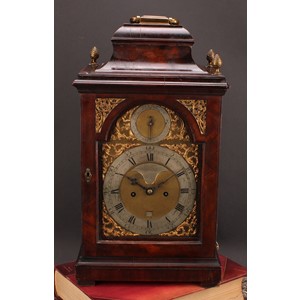 A George III mahogany repeating bracket clock, 17.5cm arched brass dial with silvered chapter ring and cartouche inscribed John Ward, London, Roman and subsidiary Arabic numerals, Strike/Silent, date aperture, twin winding holes, eight-day verge fusee repeater movement striking on a bell, engraved backplate, the pagoda top case with brass carrying handle, 48cm high, c.1765