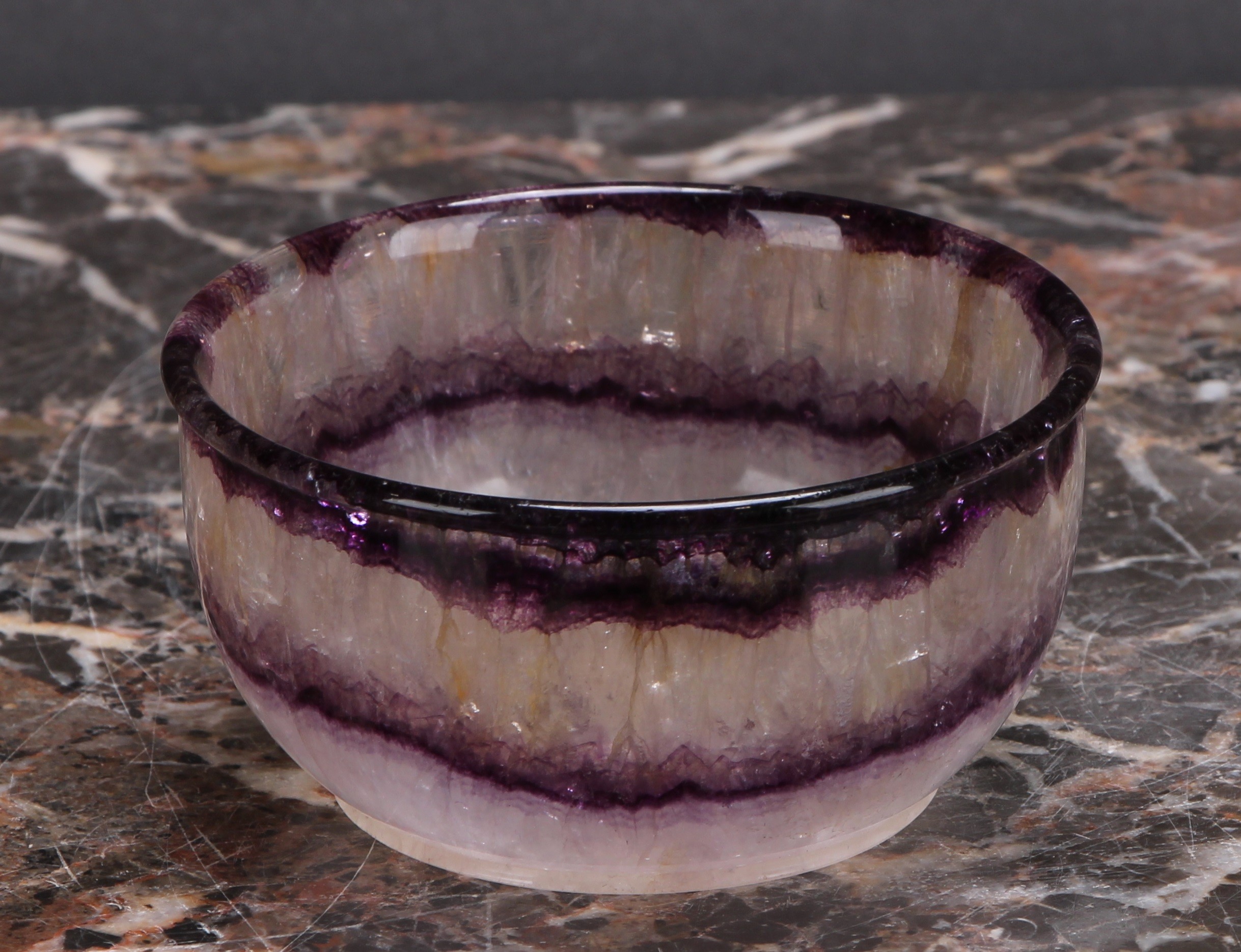 A 19th century Derbyshire Blue John circular bowl, Miller's vein, 9cm diam