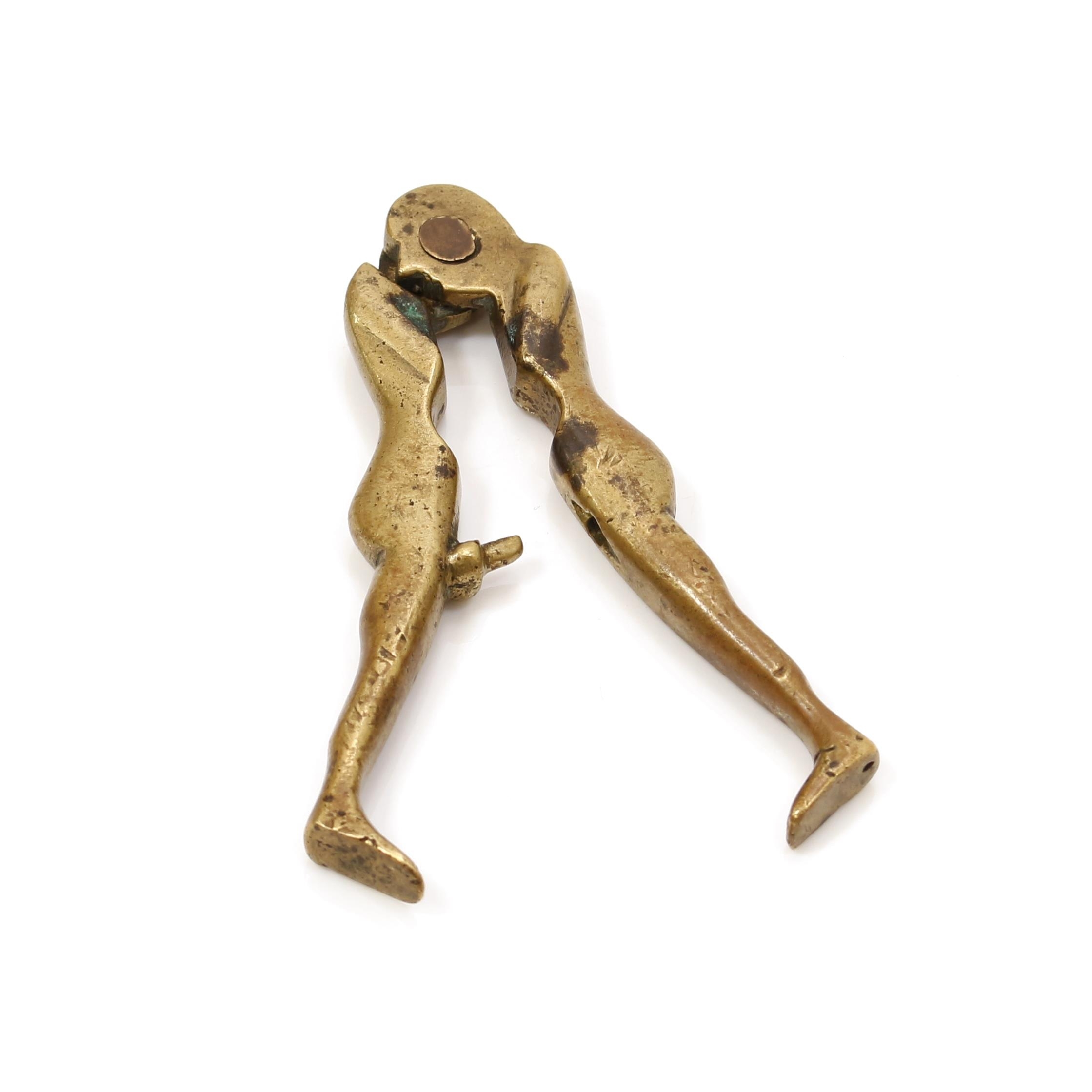 Nutcrackers - Erotica - a 19th century brass lever-action nut cracker, erotic subject, 8.5cm long