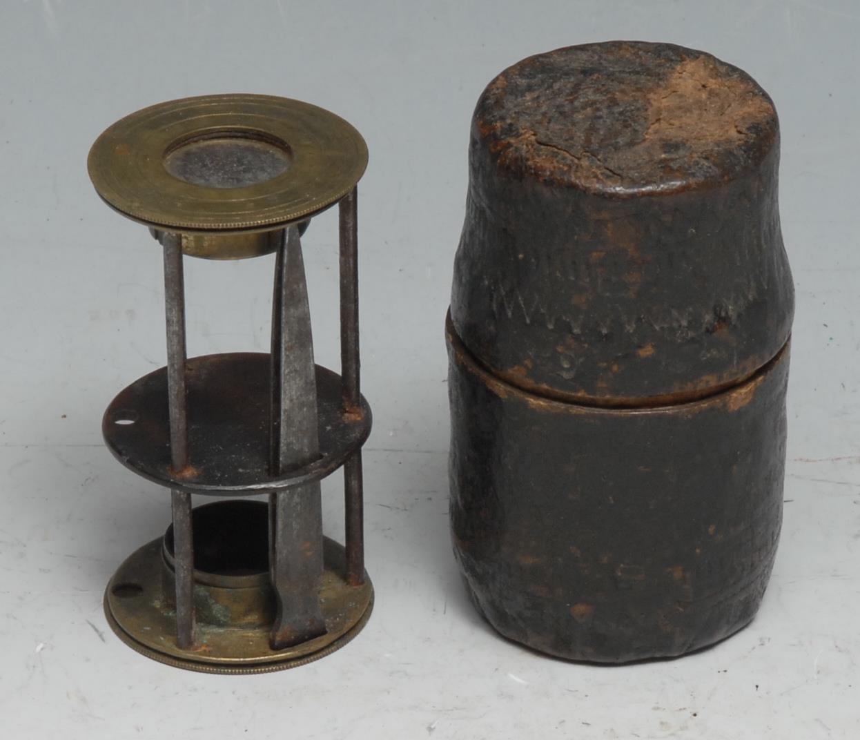 An 18th/19th century travelling pocket field microscope, tweezers ensuite, 6.5cm high, cylindrical slip case