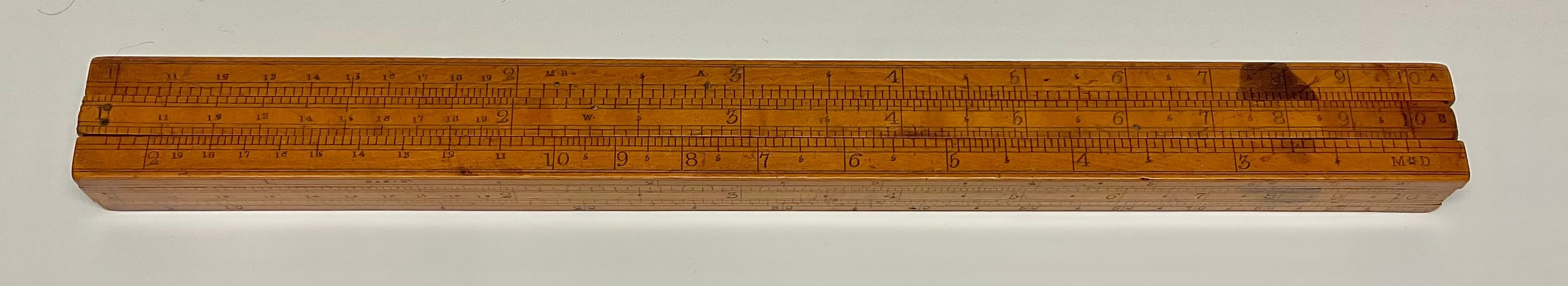 An early 19th century boxwood 12" four-section slide rule, by Dring & Fage, 20 Tooley St, London Bridge, comprehensively inscribed with scales and calculations, c.1804 - 1844