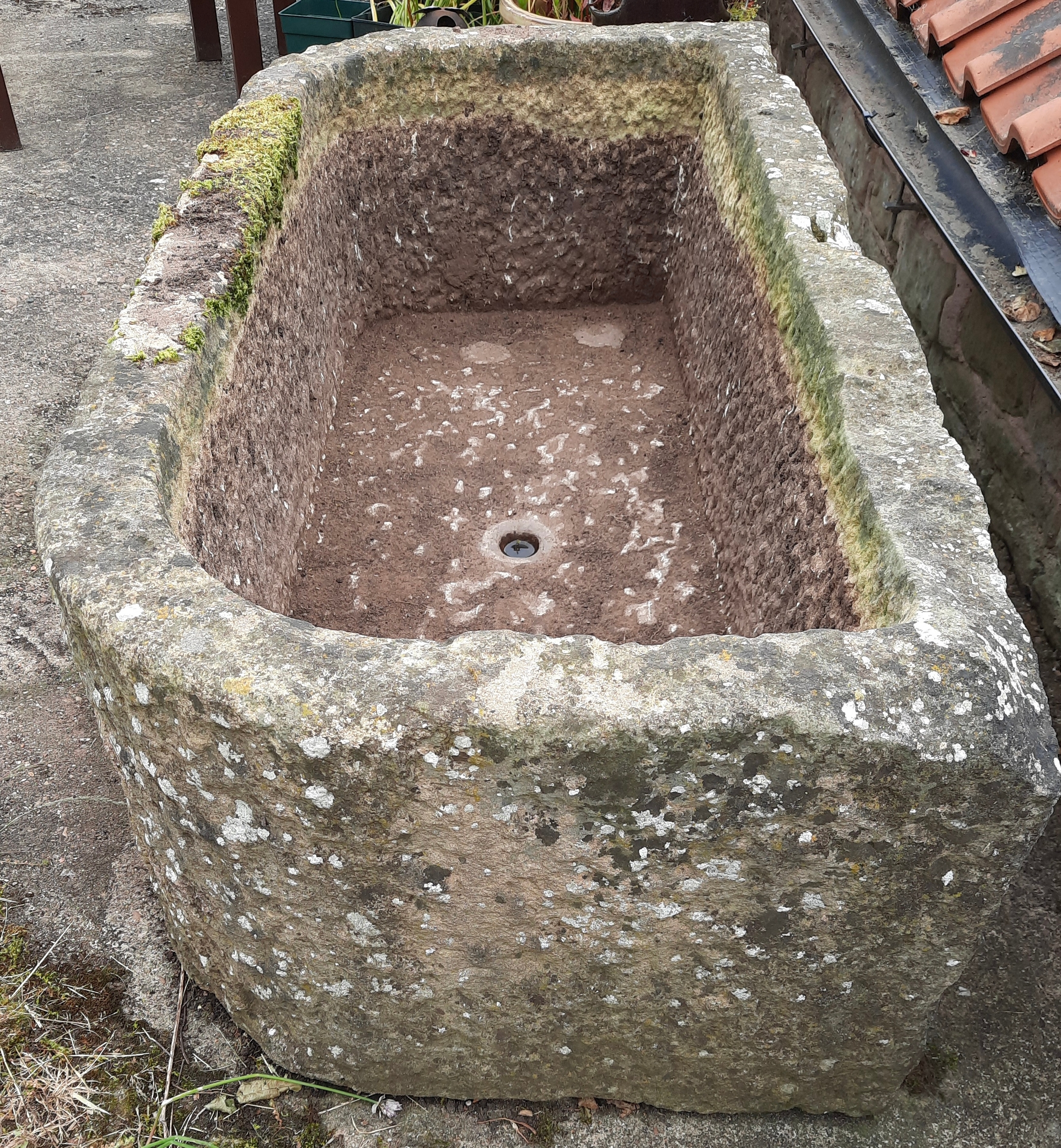 A large gritstone garden trough, 49cm high, 137cm wide, 68cm deep