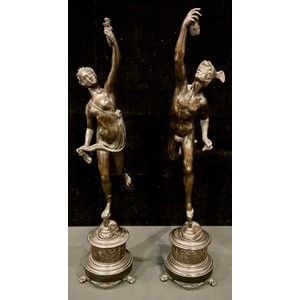 Giambologna (Italian, 1529-1608), after, a pair of dark patinated bronze sculptures, Mercury and Fortuna, each standing nude on one leg balancing on a gust of wind from the mouth of Zephyrus, cylindrical stepped bronze and black marble bases, paw feet, 81 and 78cm high