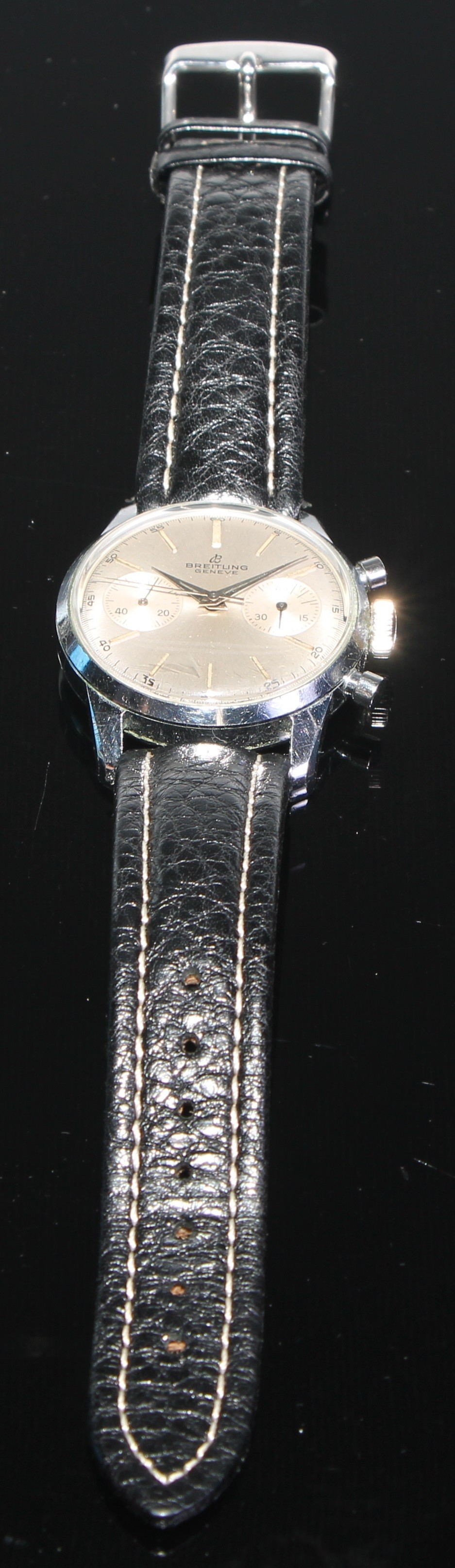 Breitling - a mid 20th century Gentleman's 1191 wristwatch, textured silvered dial, block batons, minute track, centre seconds, two subsidiary registers, manual wind 188 cal 17 jewel movement, stainless steel case, serial No 949354, associated black leather strap & buckle, 35mm diameter