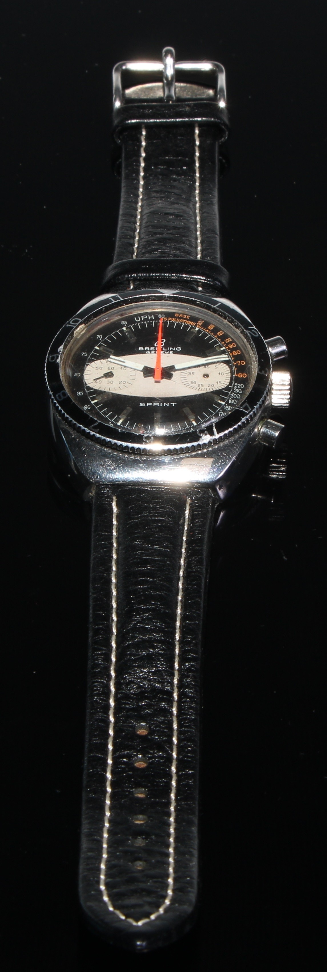 Breitling - a 1970s Sprint chronograph wristwatch, two tone black and grey dial, twin subsidiary registers, manual wind movement, stainless steel case, serial No 1341890,  associated black leather strap, 37mm diameter