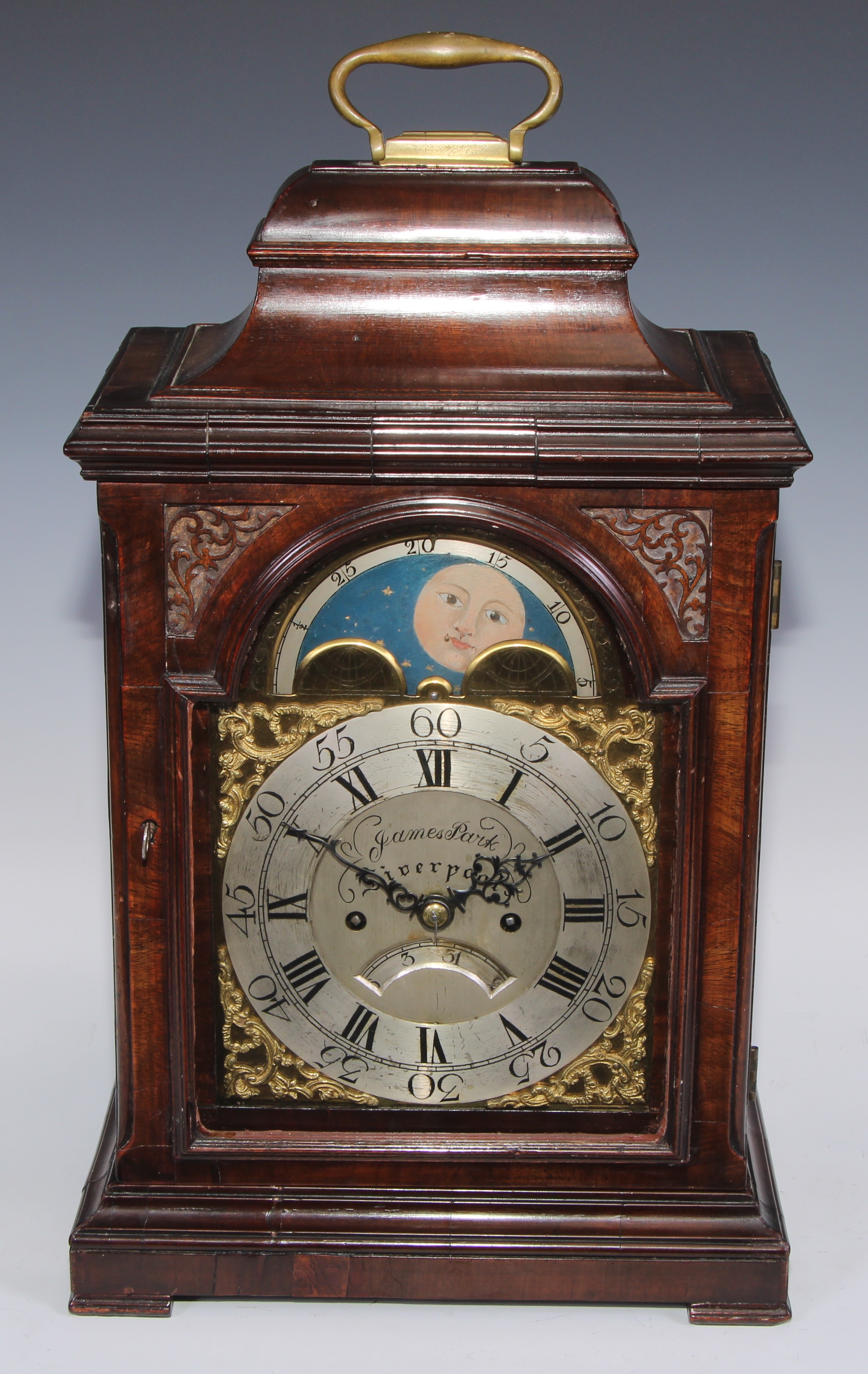 A George III mahogany bracket clock, 17cm arched brass dial with silver chapter ring, inscribed James Park, Liverpool, rolling moonphase to arch, date aperture, twin winding holes, eight-day fusee movement with anchor escapement striking on a bell, the pagoda case with brass carrying handle, glazed sides with pierced sound-frets, bracket feet, 47cm high, c.1770