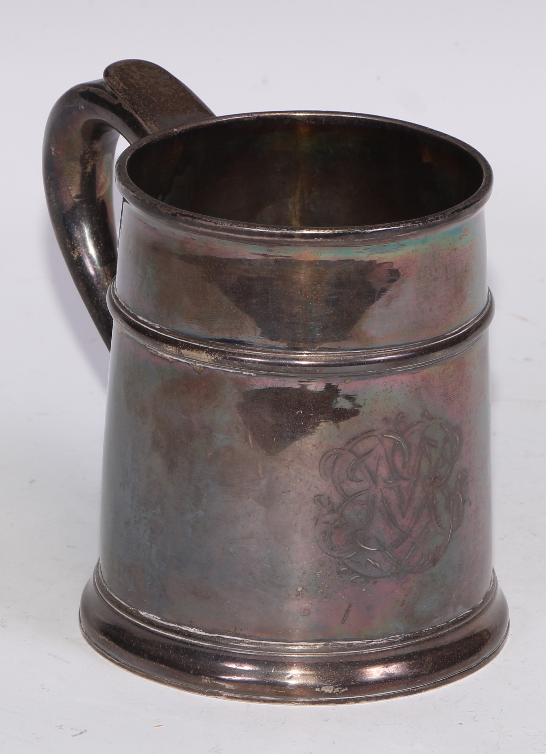 A Queen Anne Britannia silver mug, quarter girdle, S-scroll handle, skirted base, 12cm high, Anthony Nelme, London 1708, 348g