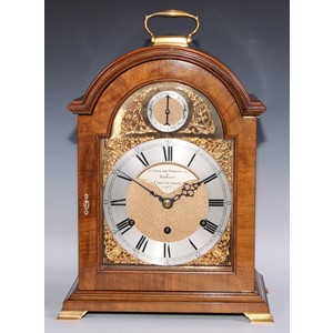 A George III design gilt metal mounted mahogany musical bracket clock, 18.5cm silvered chapter ring, inscribed Sinclair, Harding and Bazeley, Cheltenham, Roman numerals, Arabic subsidiary numerals, three wining holes, triple fusee movement, alternating strike/silent, inset spandrels, the case quite plain, 47cm high over handle