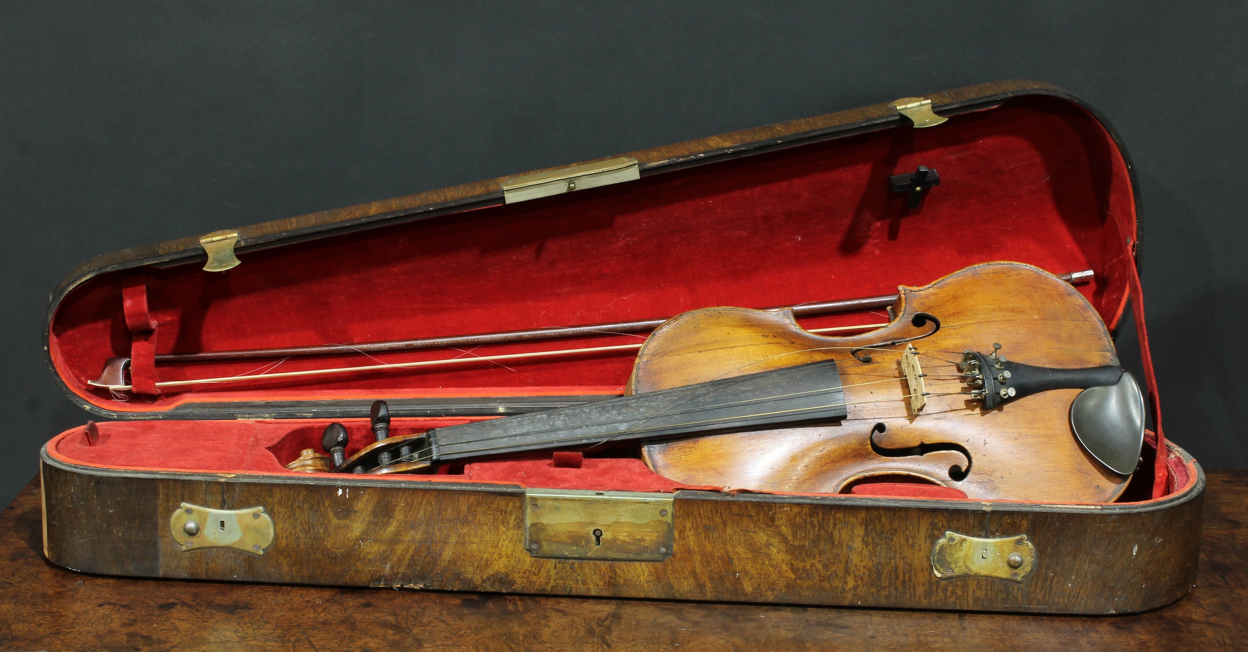 A violin, the two-piece back 35.75cm long excluding button, rosewood tuning pegs, outlined throughout with purfling, 59.5cm long overall, the bow unsigned, 73.5cm long, cased