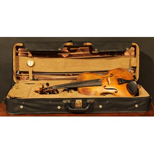 A violin, the two-piece back 35.5cm long excluding button, paper label printed Joseph Guarnerius, rosewood tuning pegs, outlined throughout with purfling, 60cm long, modern bow and case