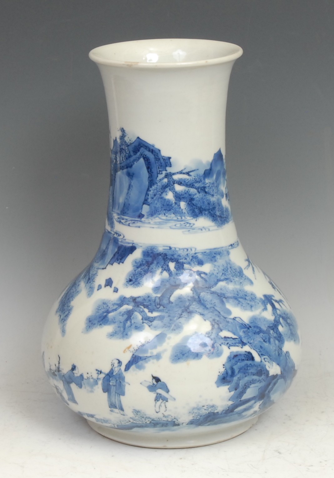 A Chinese porcelain bulbous vase, painted in underglaze blue, with figures in a rocky landscape, elongated flared neck, 31cm high, six character mark, 19th century