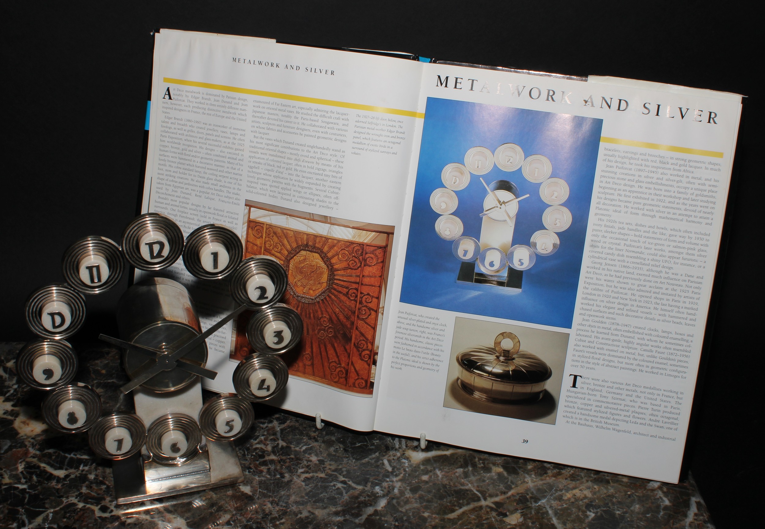 A French Art Deco design Jean Elysée Puiforcat Constellation timepiece, 19.5cm overall clock chapter ring diameter, applied with Arabic numerals, the base inscribed JEAN E. PUIFORCAT BRONZE, 21cm high overall