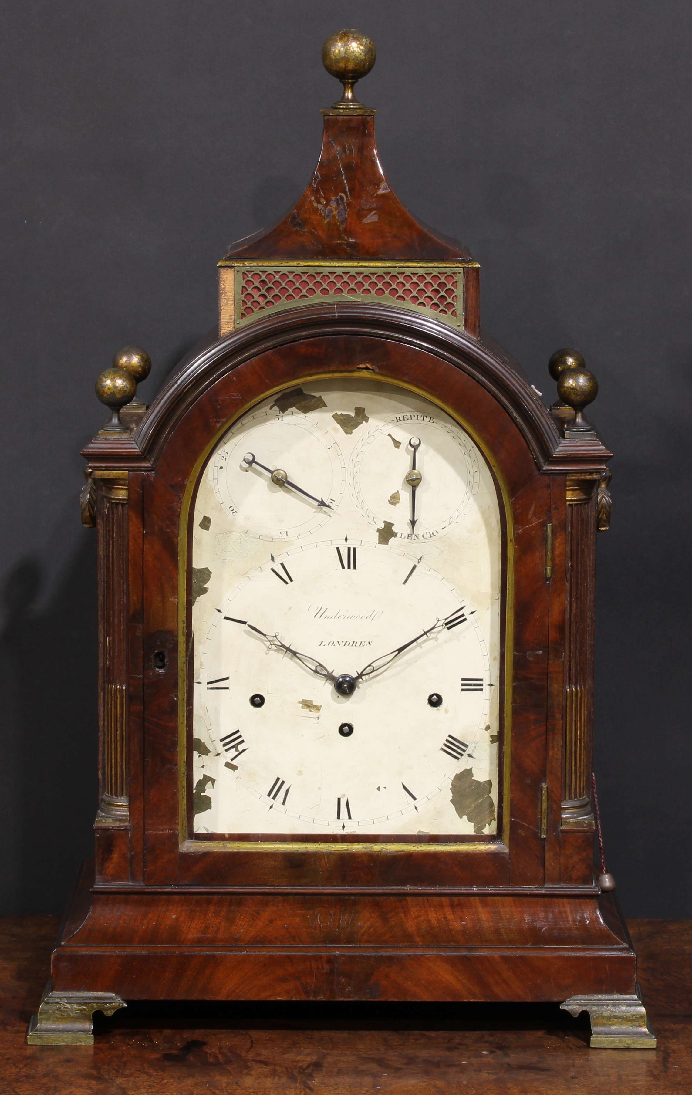 A large George III mahogany musical repeating bracket clock, 20cm arched painted dial inscribed Underwood, London, Roman numerals, regulation and Repite/Silencio setting dials to arch, triple-winding holes, fusee movement striking on a bell and chiming on a nest of eight bells, engraved backplate, the pagoda top case with brass ball finials and stop-fluted quarter-columns, brass bracket feet, 67cm high, c.1800