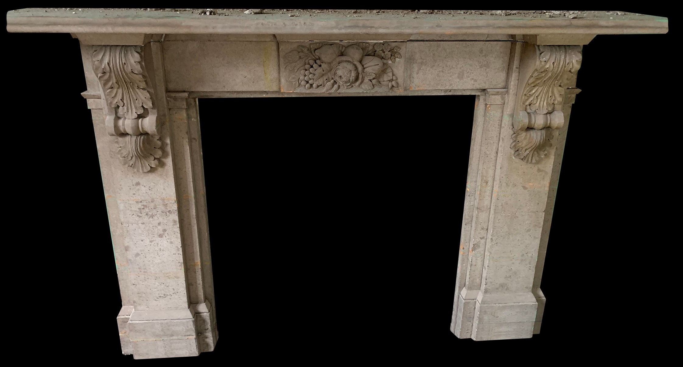A Victorian Hopton Wood stone fire surround, quarried from Middleton-by-Wirksworth, Derbyshire, carved with a bountiful arrangement of fruit and flowers, the jambs applied with acanthus scroll brackets, 118.5cm high, 194cm wide, 35cm deep, c.1850  Hopton Wood has been used in notable buildings such as the Houses of Parliament, Westminster Abbey and Chatsworth House. It was also chosen by Margaret Thatcher for the entrance hall flooring in her Belgravia home where she resided for over 20 years until her death.