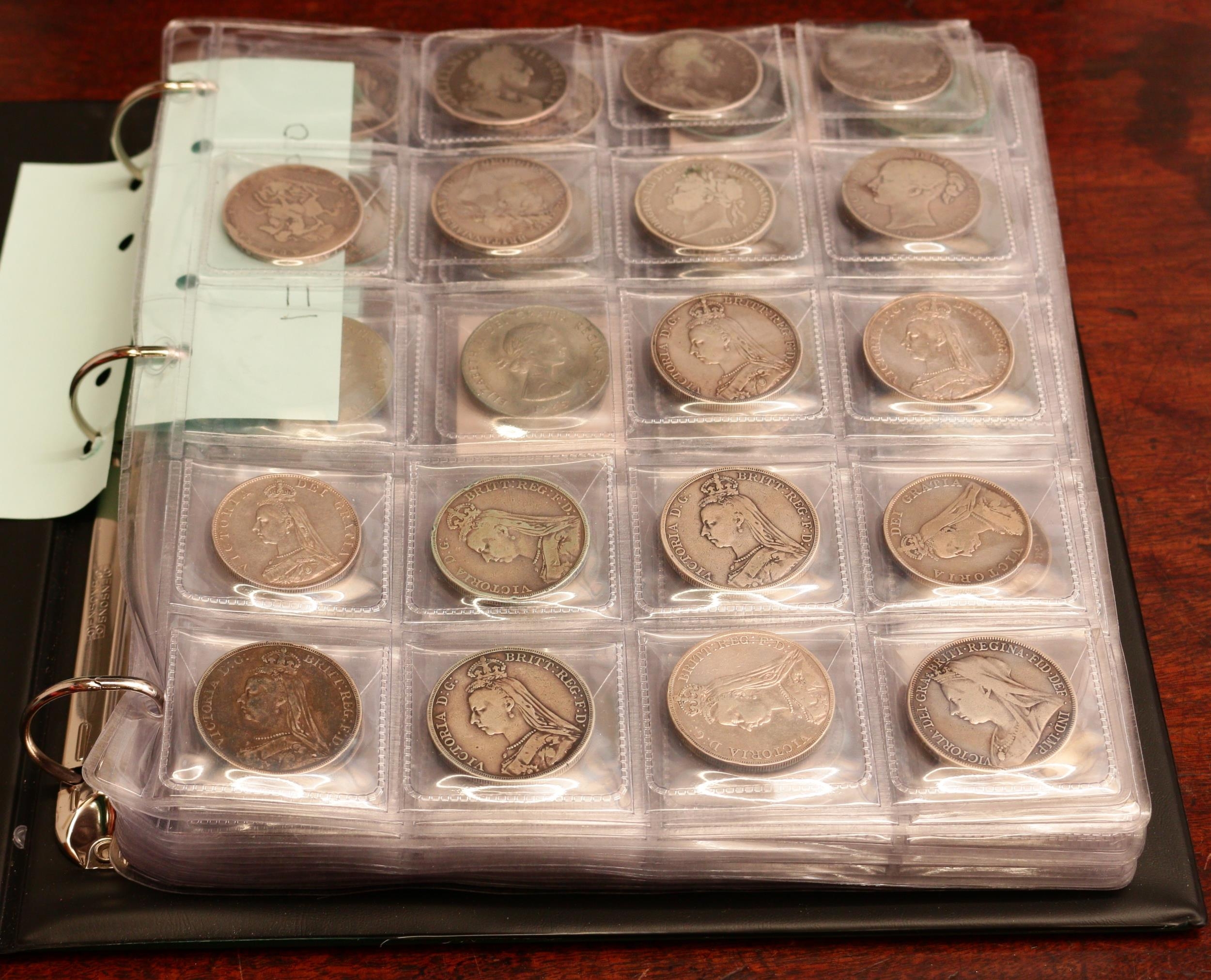 A collection of UK mainly silver coins – green ring binder album in slip case containing a selection of UK milled silver coins, Charles II to George VI including crowns 1696 (two) AF & F, 1819 LIX no stops on edge, F; 1821 SECUNDO VF/GF, another GF; 1845 star stop F; double florins 18878 Jubilee Head Roman I AEF; half crowns, 1689 1st bust F/GF; 1816 bull head F & 1817 bull head AVF;1906 GVF; 1925 F, Florins 1856 GF/F; shillings including 1723 SSC in angles AVF; 1758 VF; 1898 A/Unc; sixpences: including 1697E F & 1758 GEF; groat, British Guyana 1891 AEF & Threepence Elizabeth I milled 1562 GF (Qty)