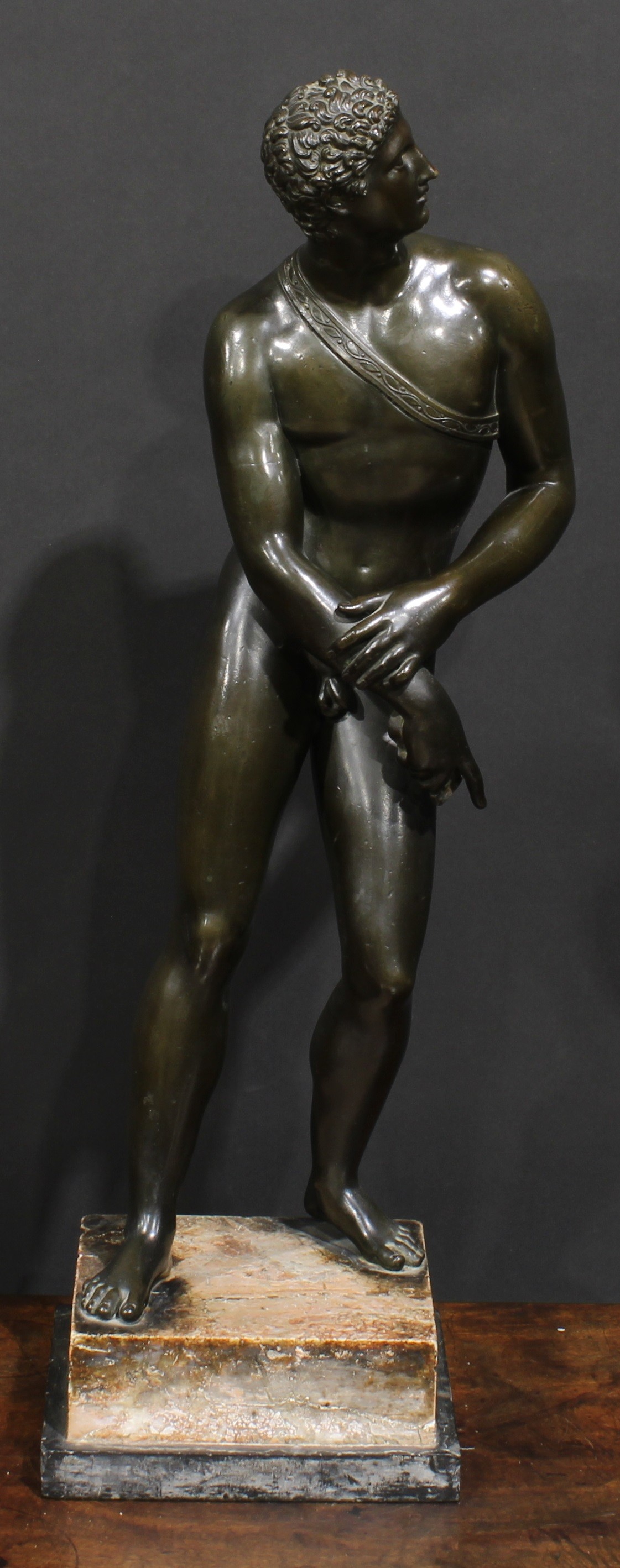 Italian Grand Tour School (19th century), a brown patinated bronze, after the Antique, stepped marble base, 62cm high