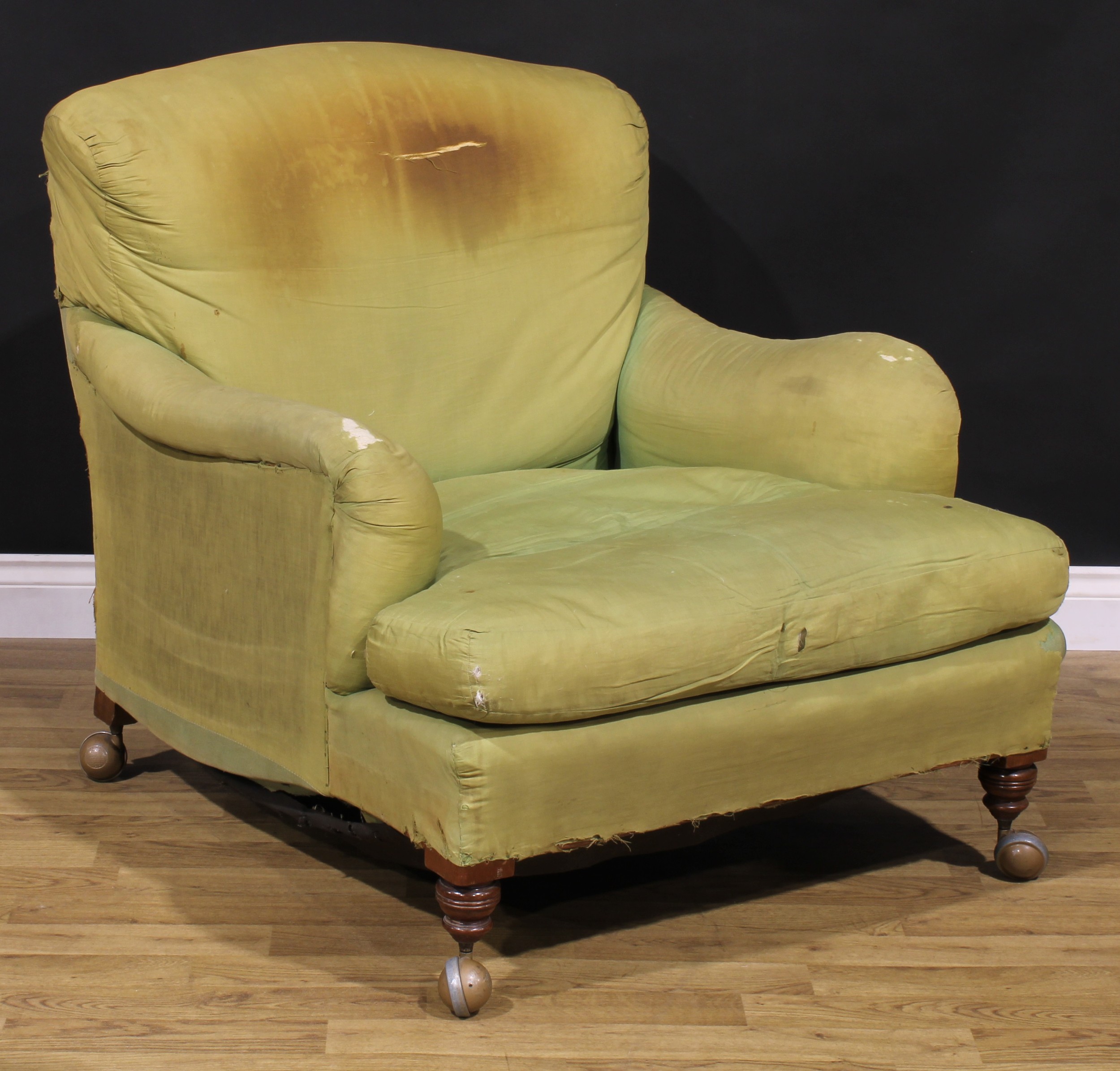A 19th century Bridgewater type easy chair, by Howard & Sons, stuffed-over upholstery, stamped 7426 3312 HOWARD & SONS LTD, BERNERS ST, 88.5cm high, 84cm wide, the seat 51cm wide and 75cm deep