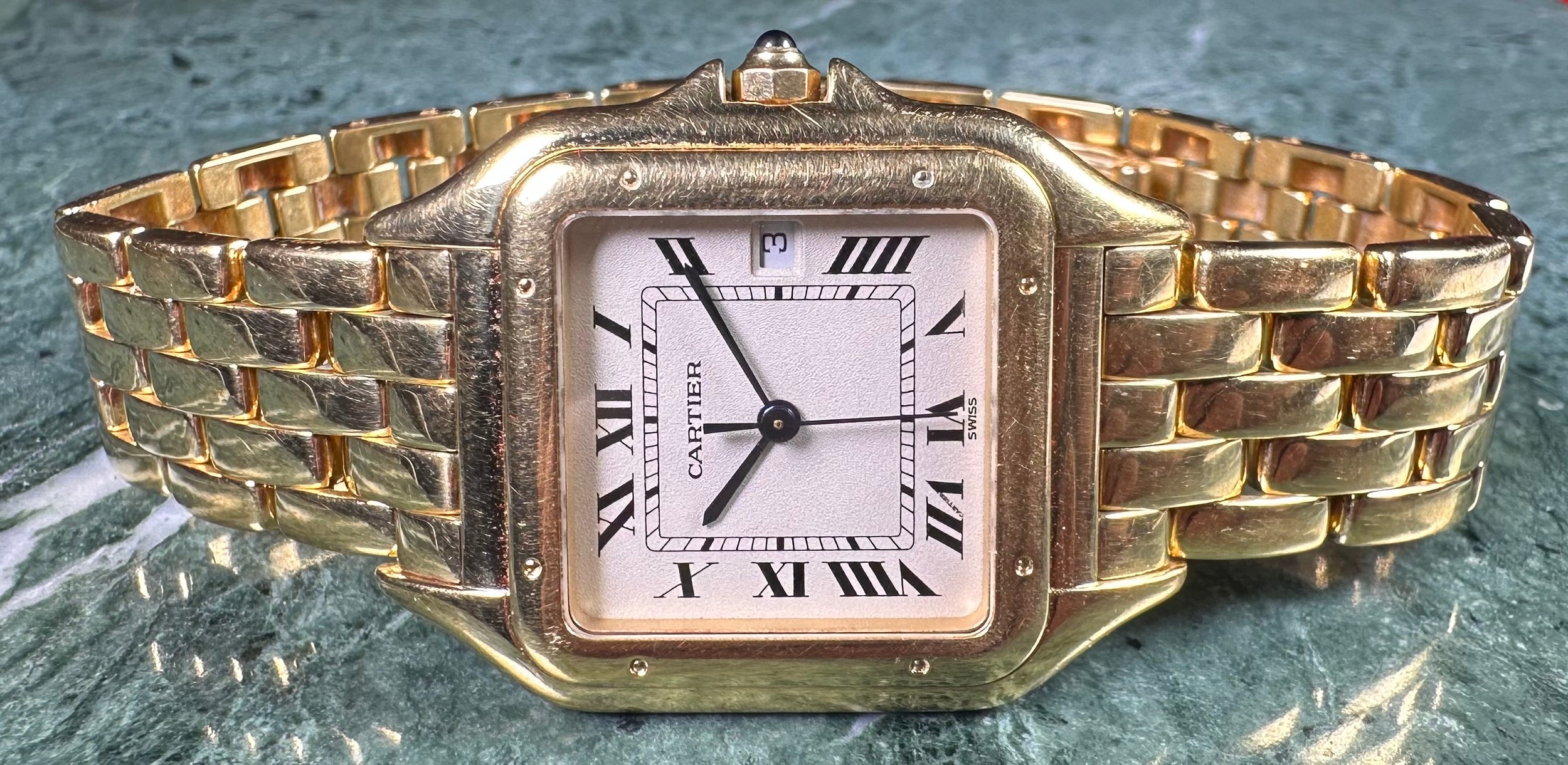 A Cartier 18ct gold gentleman's wristwatch, square dial, Roman numerals, blued hands, date aperture, the original 18ct gold brick link strap stamped 750, the dial 1.8cm wide, 113g gross, red 'velvet' bag