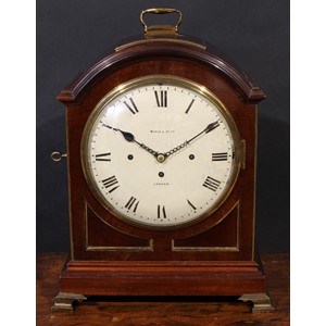 A late Victorian mahogany musical repeating bracket clock, in George III Revival style, 26cm convex painted dial inscribed Maple & Co Ltd, London, Roman numerals, three winding holes, Chime/Silent to side, the triple-fusee movement with pull-repeat, striking and chiming on gongs, the arched case with brass carrying handle and ogee bracket feet, 53cm high overall, c.1890