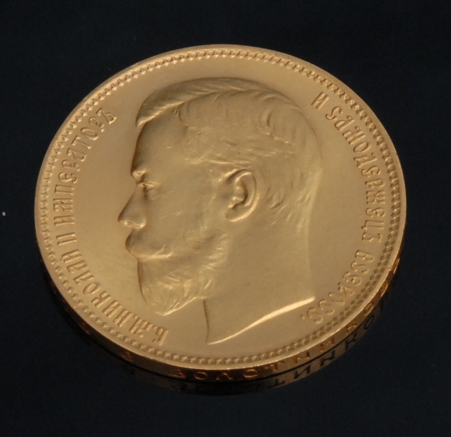 A gold re casting Russian Empire Nicholas II 1902 37 Rubles, 50 Kopecks coin, obverse bearded bare head facing left, reverse crowned double-headed imperial eagle holding scepter and orb with coat of arms, the edge inscribed 'Pure Gold 6 zolotniks 77.4 dolyas', 32.23g