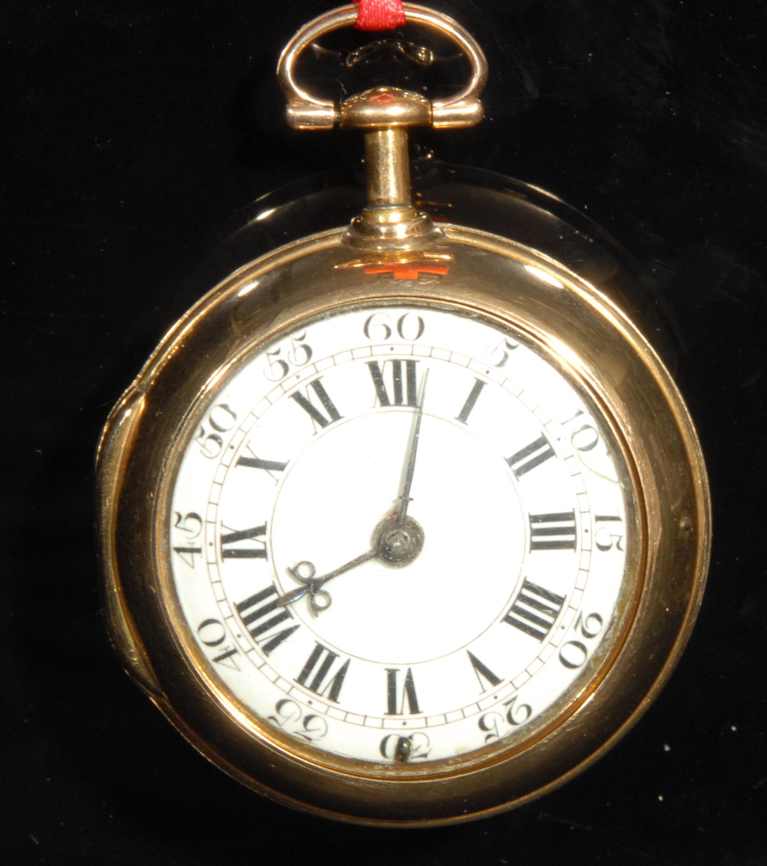 An early 18th century 18ct gold repeating pair case pocket watch, by James Snelling, London, 3.5cm white enamel dial inscribed with Roman numerals and Arabic subsidiaries, blue steel beetle and poker hands, the signed key wound verge fusee movement with Tompion type regulator and silver balance cock pierced and engraved with scrolling foliage, spreading cylindrical pillars, signed silver coloured metal dust cover, the inner case pierced and finely engraved with scrolling foliage, mythical birds and grotesque mask cartouche, the outer case quite plain, 6.5cm over loop, outer case 33g, watch with case 134g gross