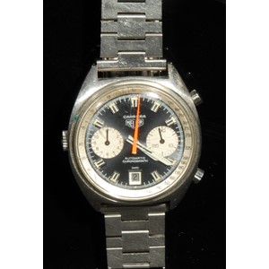 A gentleman's Heuer Carrera automatic chronograph stainless steel wristwatch, black non-reflective dial, luminous baton indicators and rotating hands, orange centre seconds hand, Tachy bezel with Arabic numerals, pair of subsidiary dials, date aperture, replacement stainless steel bracelet strap, original Heuer clasp present, winder with Heuer logo, paper label, c.1970