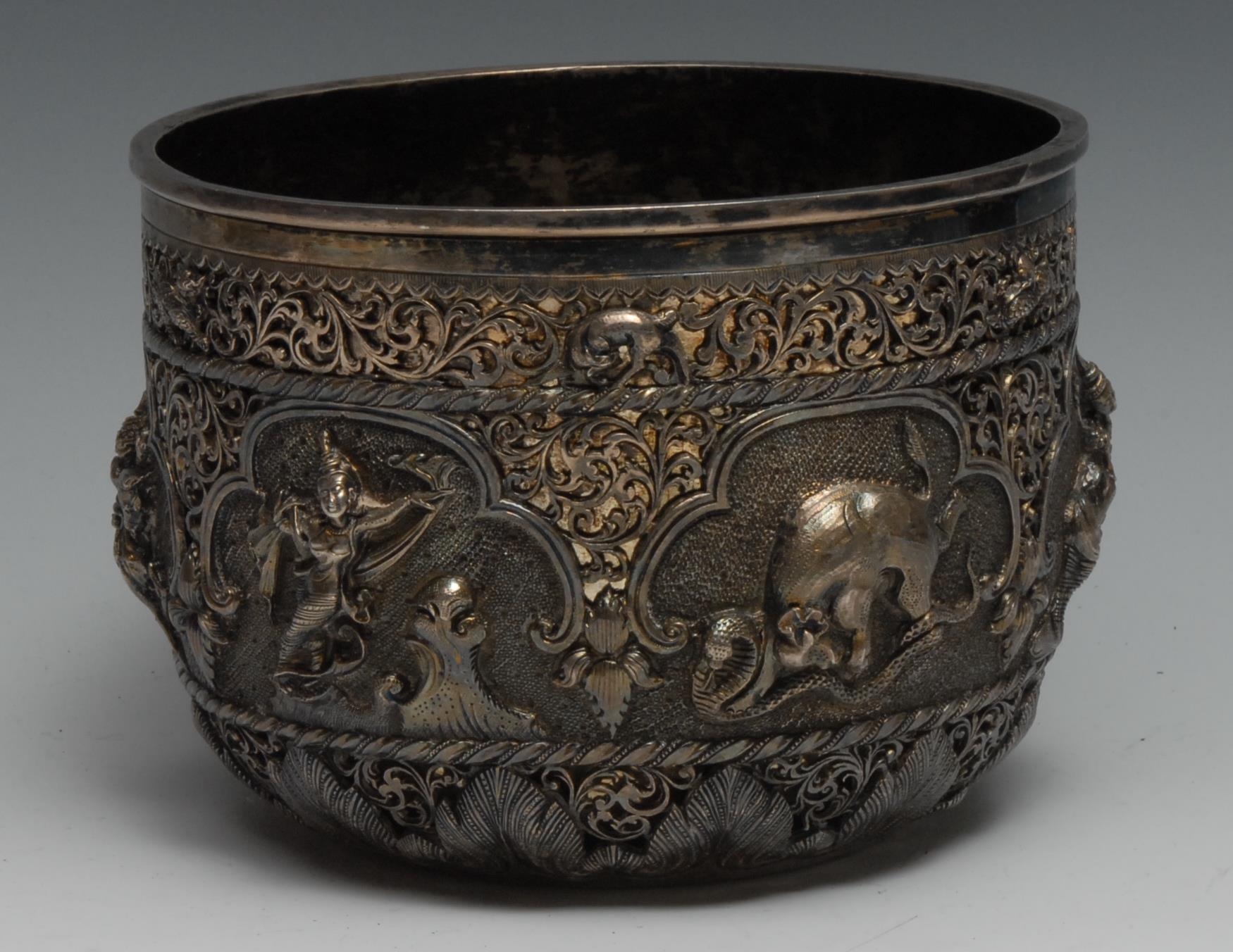 A Burmese silver bowl, of double-walled construction, the outer pierced and chased with animals and figures, 16cm diam, the base marked MSY 30, c.1900, 940g