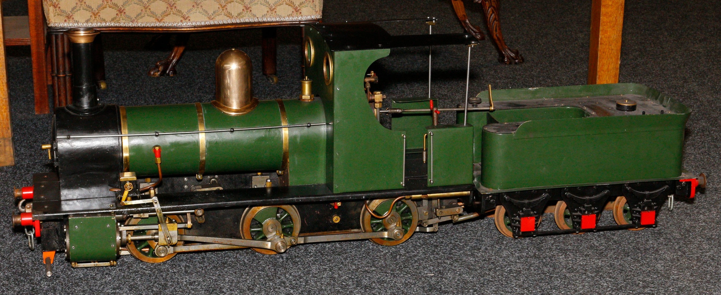 Live Steam and Model Engineering - a scratchbuilt 5" gauge live-steam 'Polly IV' 0-6-0 locomotive and six wheel tender, green and black livery, approximately 130cm with tender attached; accompanied with various plans and technical drawings