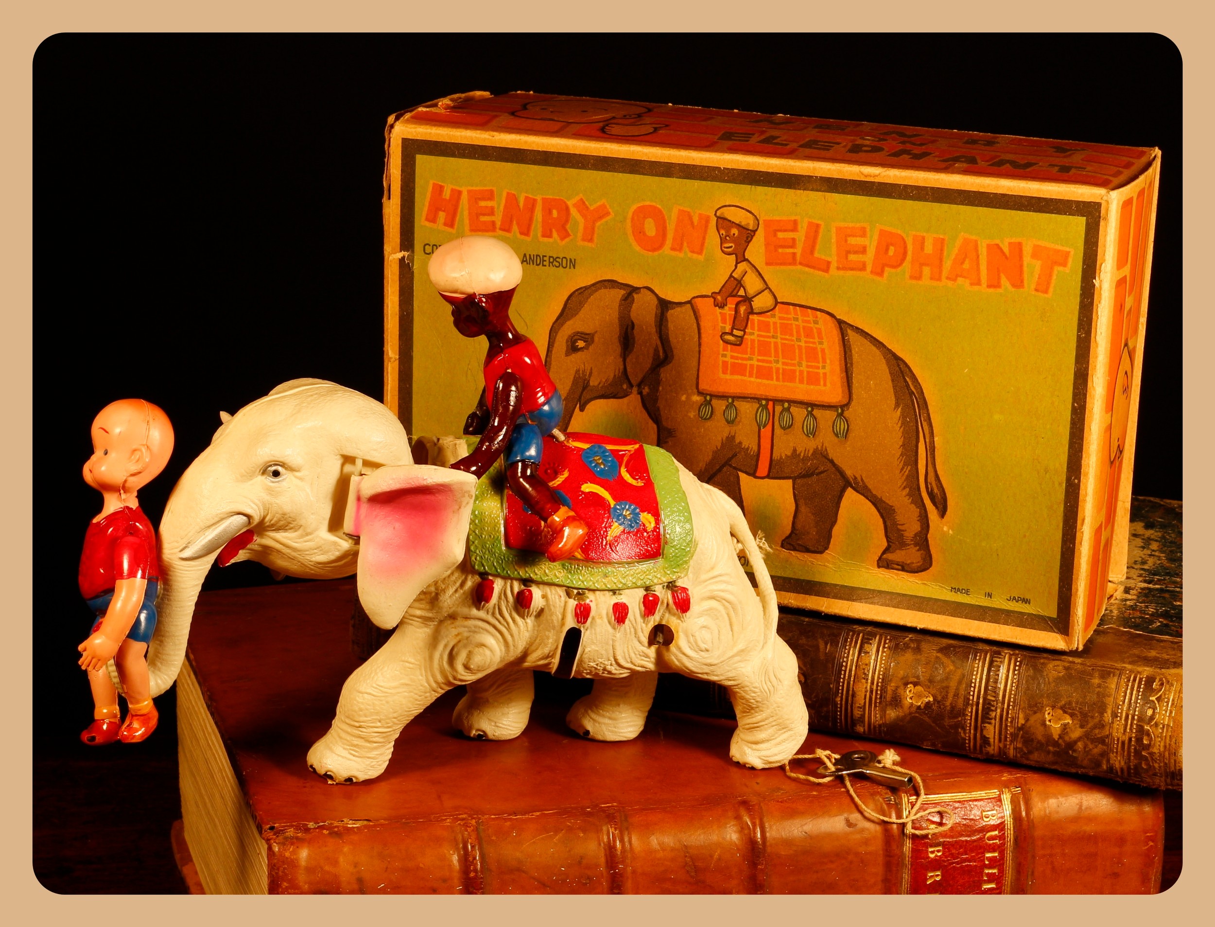 Henry, From Cartoon to Comic Strip, Lots 7000 - 7024, from a deceased single-owner collector from a Derbyshire Estate  Americana & Comic Strip Interest (Carl Anderson) – a rare C.K. (Kuramochi, Japan) celluloid and clockwork novelty Henry on Elephant toy, distributed by Geo. Borgfeldt Corporation (New York), 17cm high, boxed with clockwork key