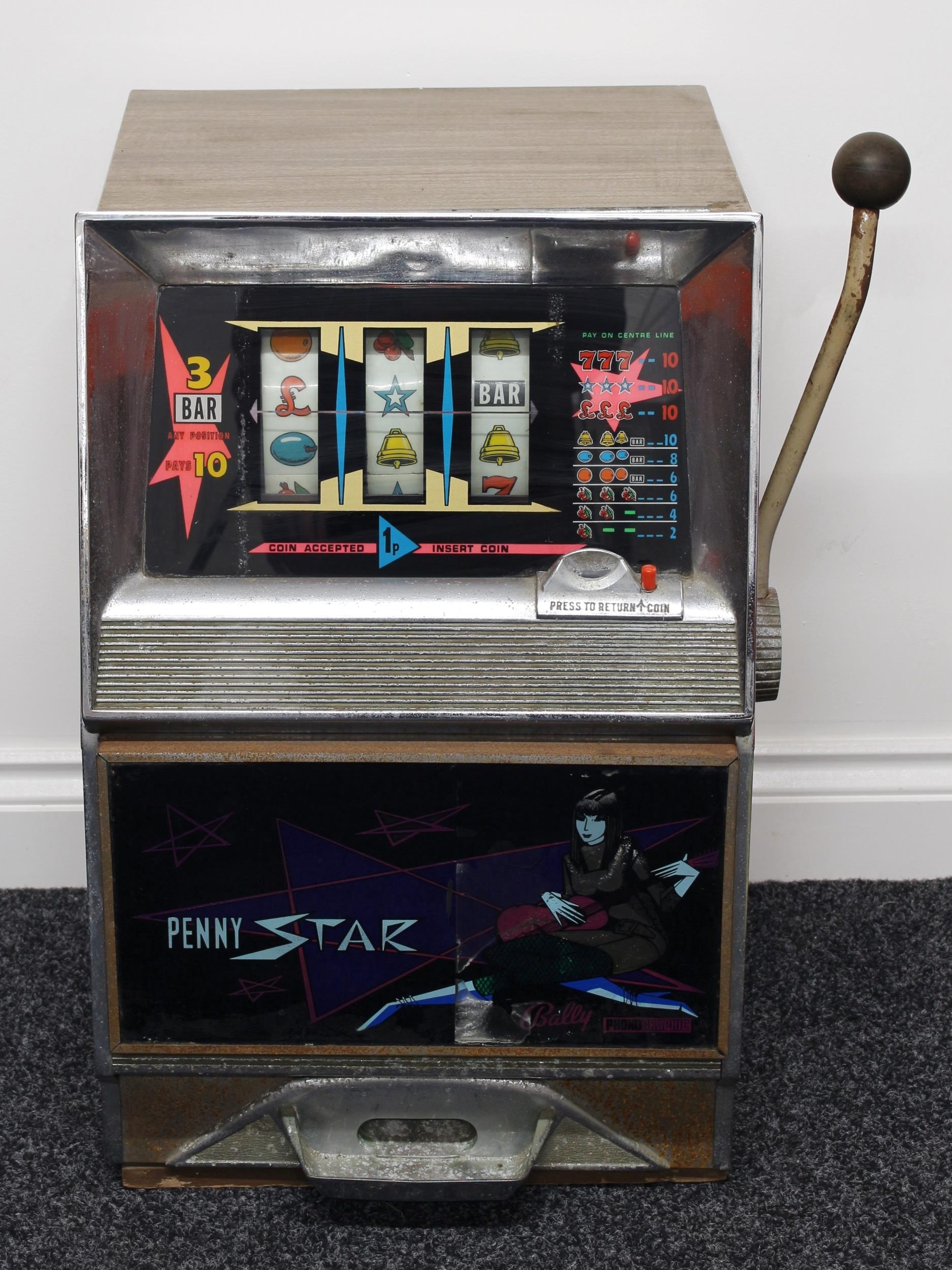 Arcade/Amusements Interest - a 1970's Bally Model 801 Penny Star mechanical fruit machine/one-arm bandit, operating three reels, 67cm high, 41cm wide, 46.5cm deep