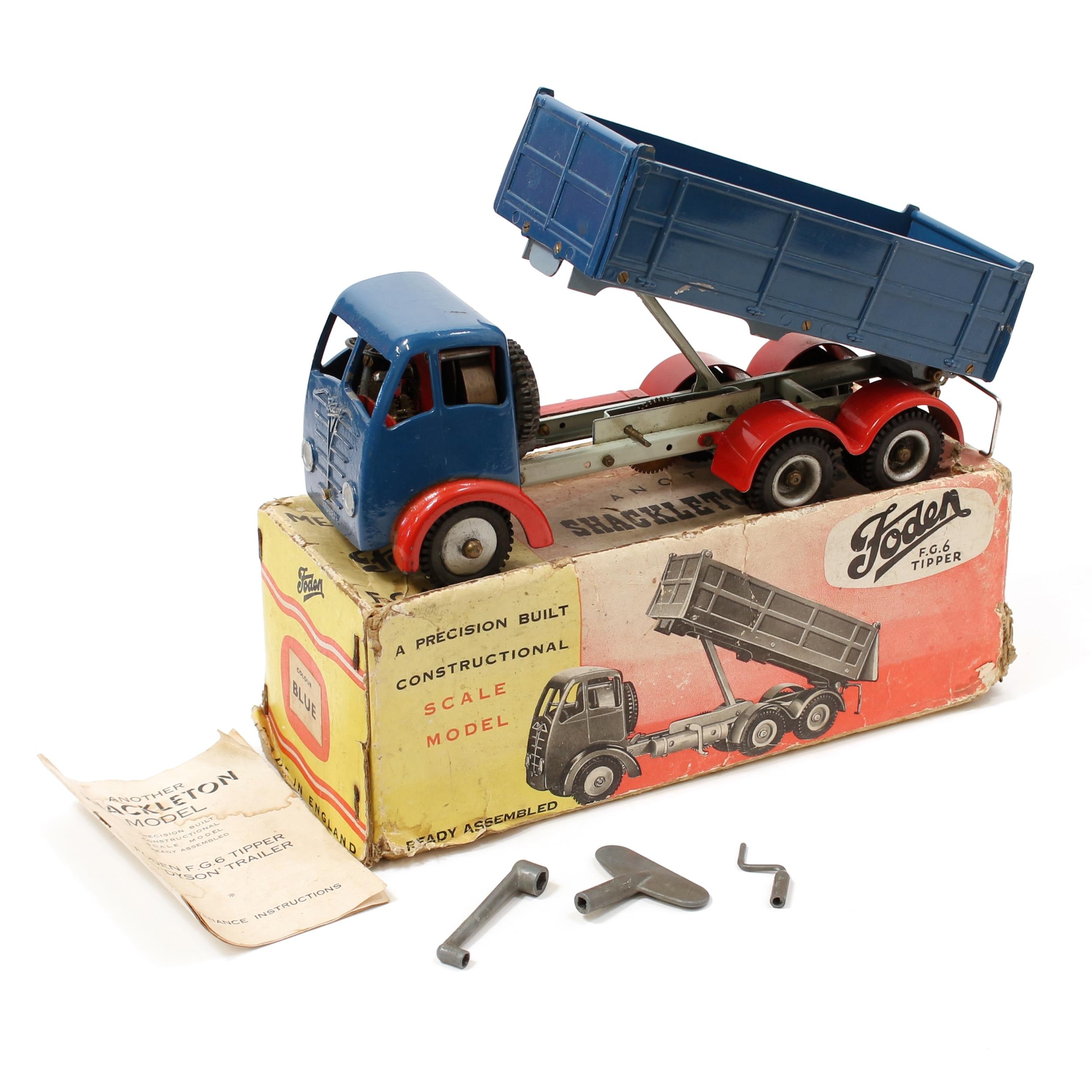 A Shackleton mechanical scale model Foden F.G.6. six wheel Tipper, dark blue cab with dark blue tipper, pale blue chassis with red wheel arches, boxed with original maintenance instructions and accessories including original clockwork key