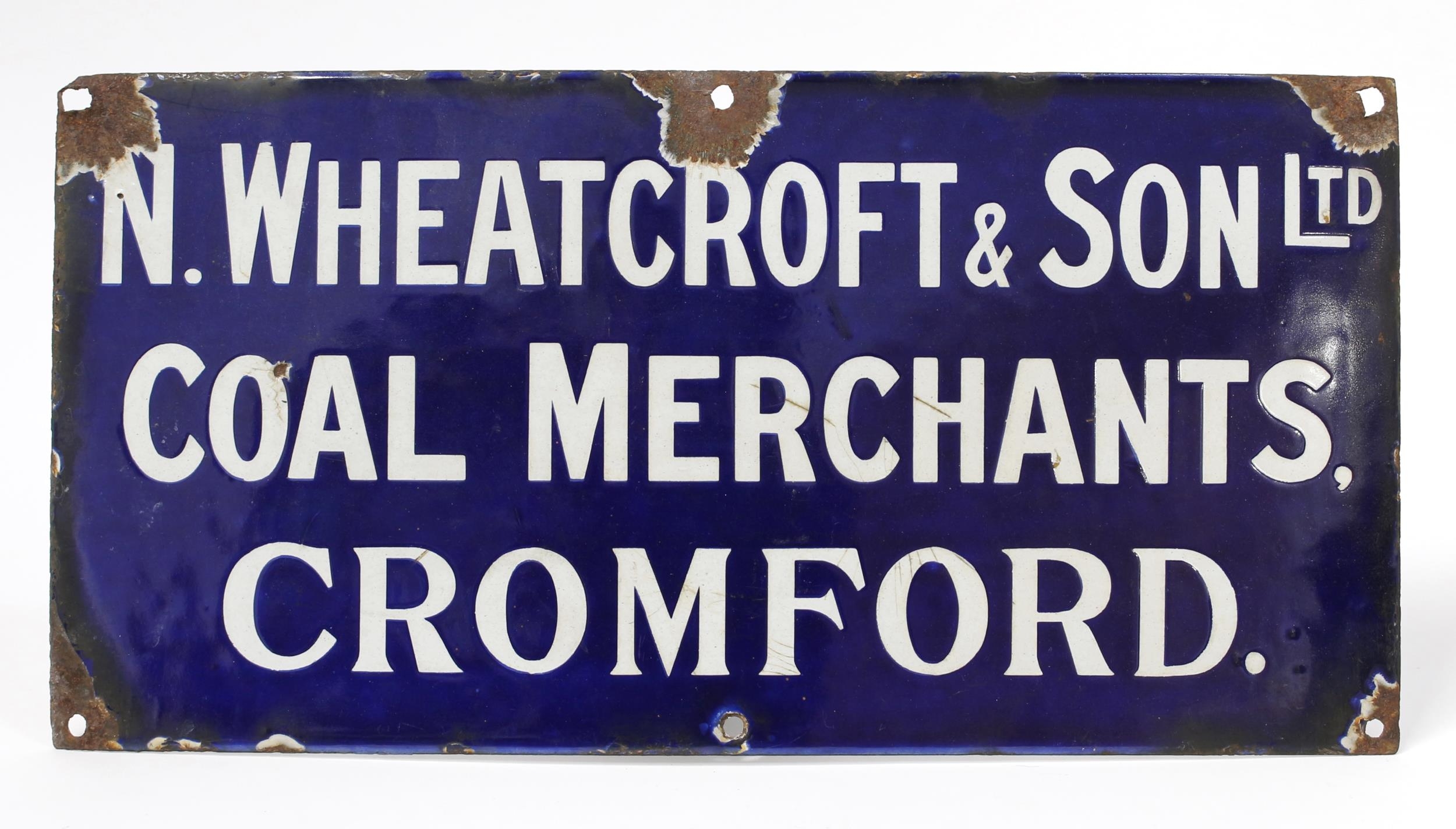 Advertising, Derbyshire Interest - a rectangular shaped single sided enamel sign, white lettering on a cobalt blue ground, 'N.WHEATCROFT & SON LTD, COAL MERCHANTA, CROMFORD.', 20.5cm high, 40.5cm wide