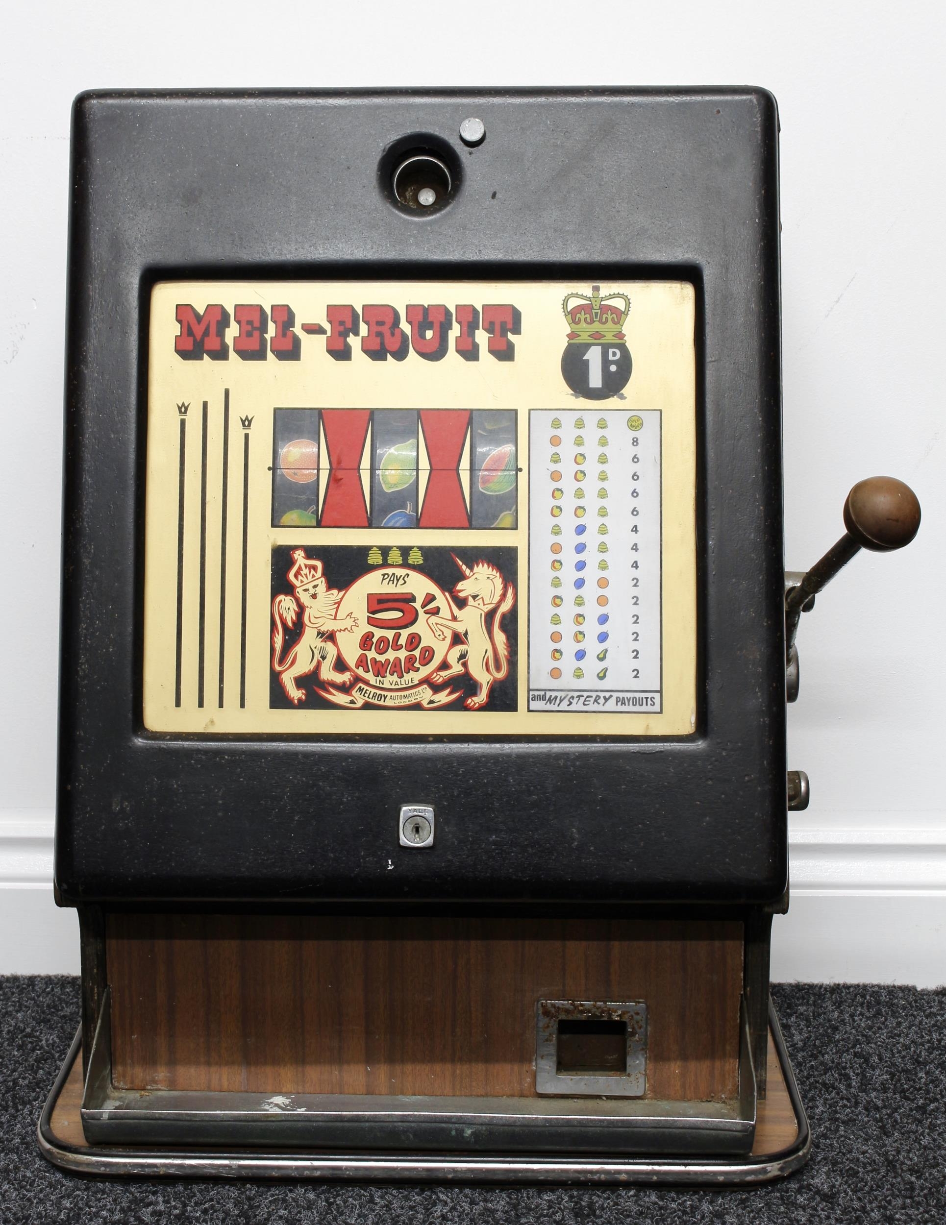 Arcade/Amusements Interest - a Melroy Automatics Ltd London Mel-Fruit mechanical fruit machine/one-arm bandit, operating three reels with 'mystery payouts', 68cm high, 43cm wide, 33cm deep, c.1960