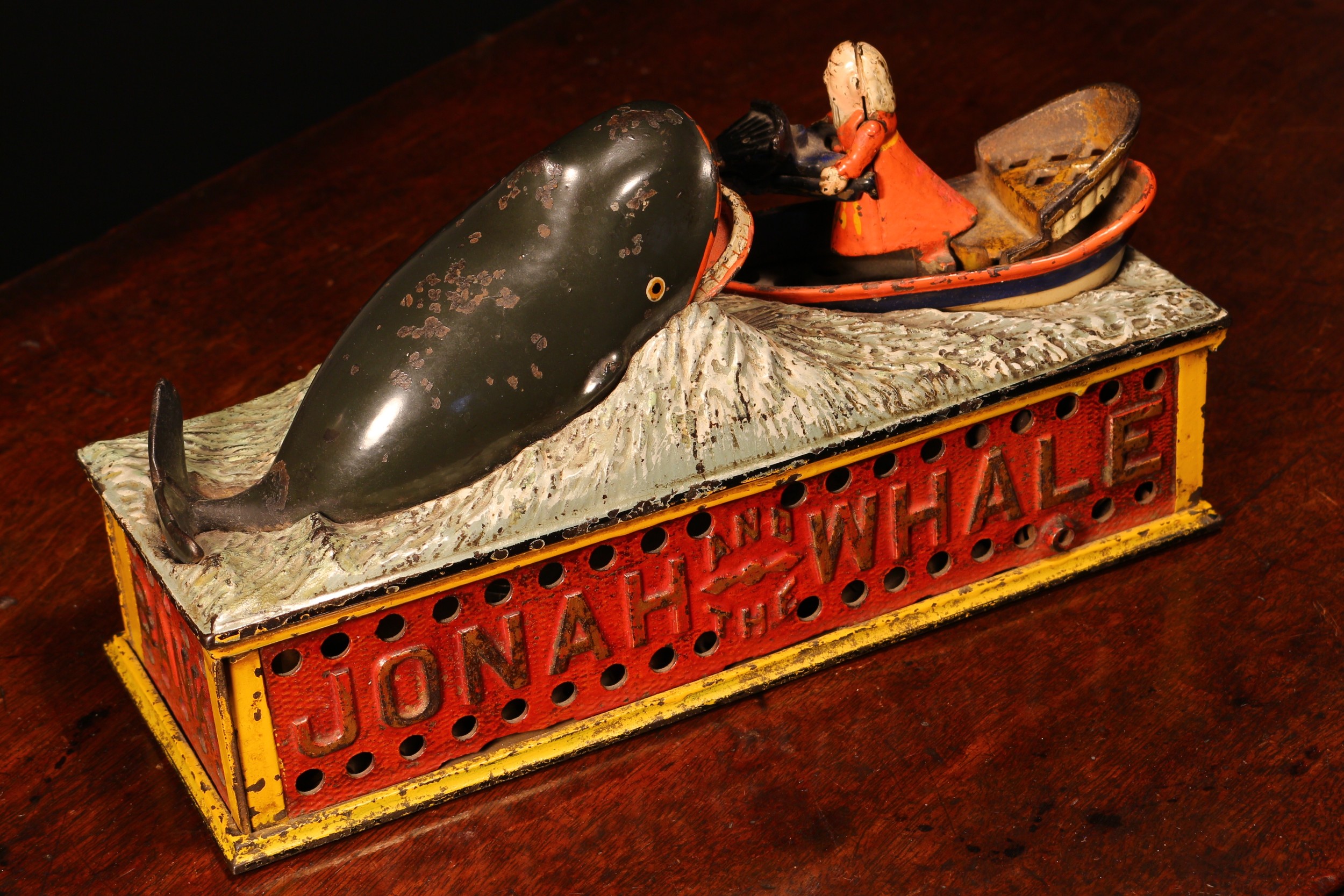 Americana - a late 19th century painted cast iron mechanical money box or bank, Jonah and the Whale, manufactured by the Shepard Hardware Co., the pierced base plate inscribed 'PAT JULY 15 1890', 14cm high